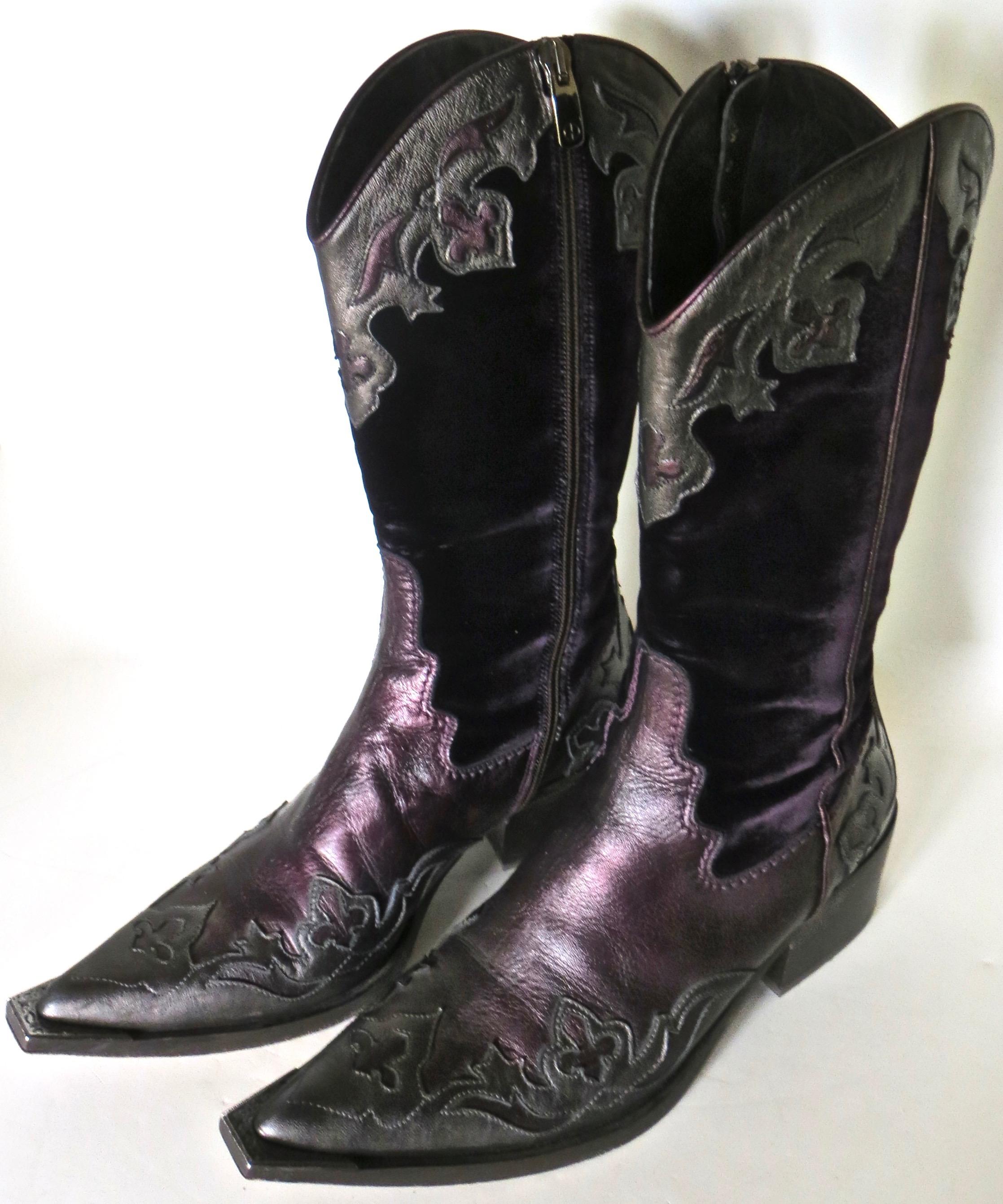 Sporting goods; get ready for the rodeo; circa 2000 beautiful and well made lady's western boots designed and manufactured by Donald J. Pliner; famous Italian luxury footwear designer.

Tool and dyed purple leather design with velvet side panels and