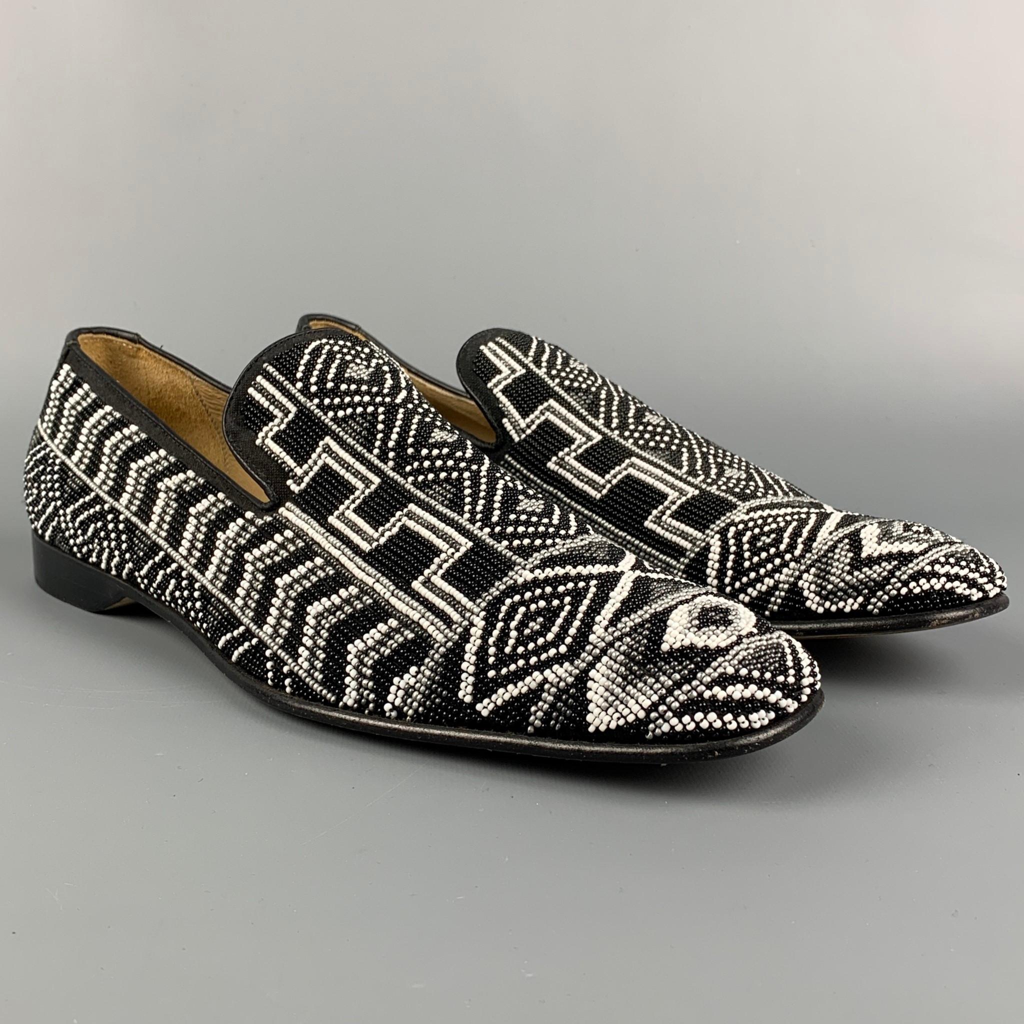 DONALD J PLINER loafers comes in a black & white beaded leather featuring a square toe and s slip on style. Made in Italy. 

Very Good Pre-Owned Condition.
Marked: 10.5 M PONTSP

Outsole: 12.5 in. x 4 in. 