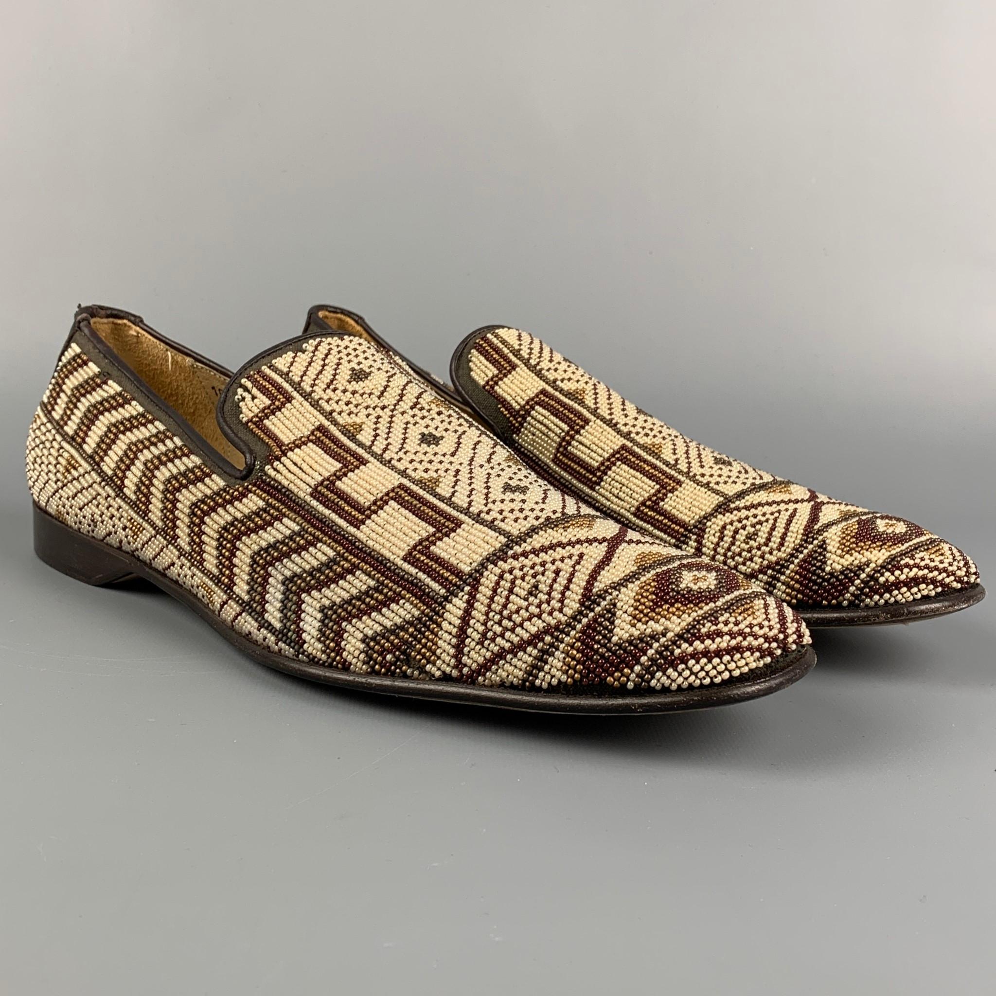 DONALD J PLINER loafers comes in a taupe & brown beaded leather featuring a square toe and s slip on style. Made in Italy. 

Very Good Pre-Owned Condition.
Marked: 10.5 M PONTSP

Outsole: 12.5 in. x 4 in. 