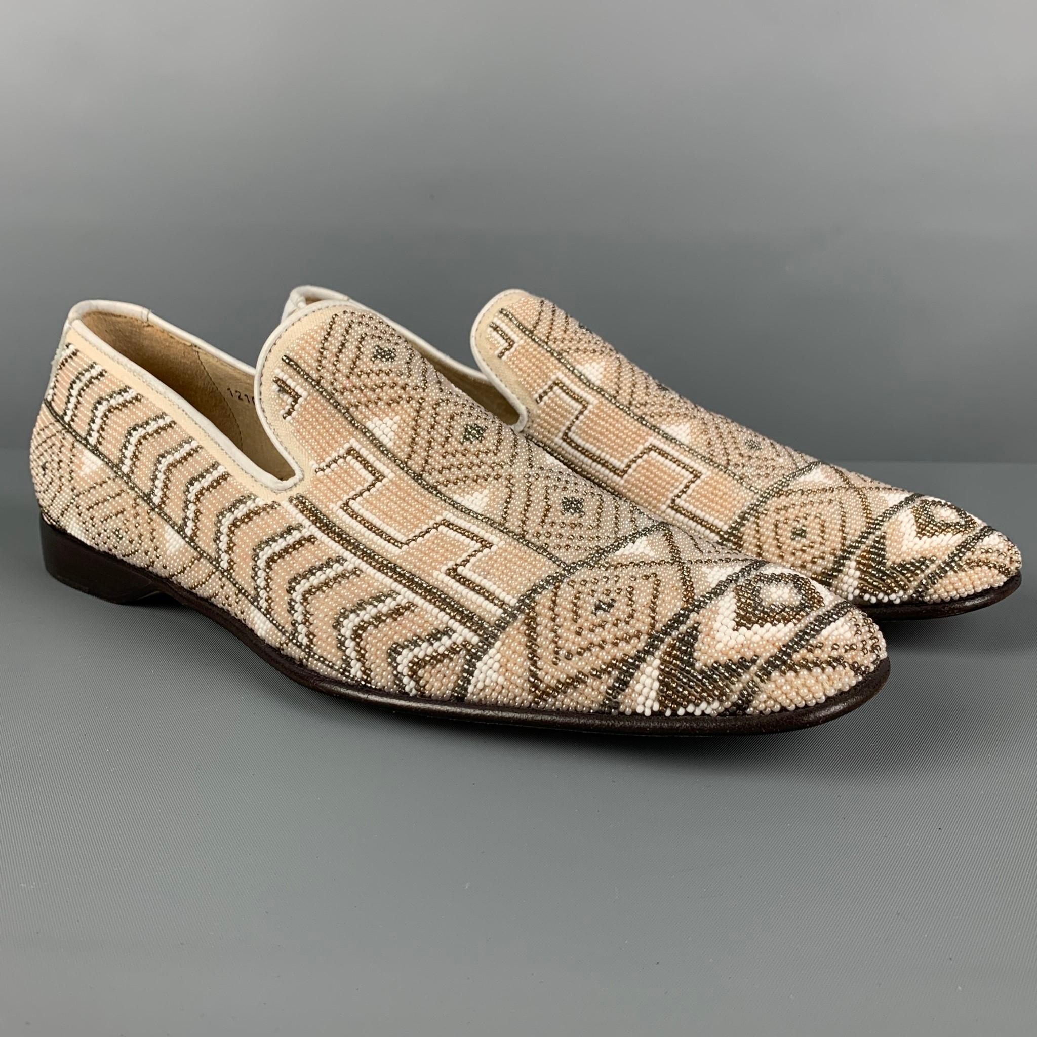 DONALD J PLINER loafers comes in a beige & white beaded leather featuring a slip on style and a square toe. Made in Italy. 

Very Good Pre-Owned Condition. Light wear.
Marked: 1210 120 9 M

Outsole: 12 in. x 4 in. 