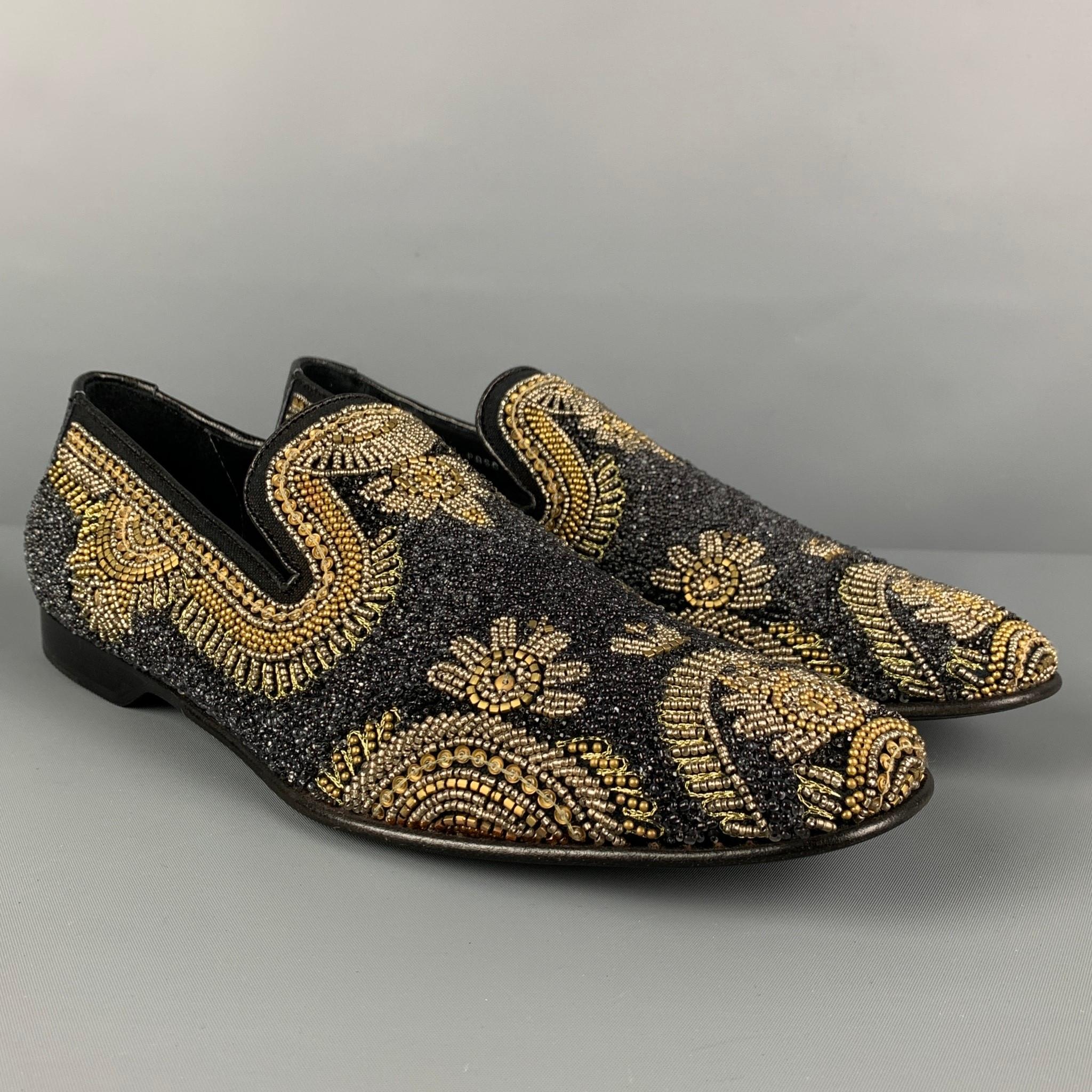 DONALD J PLINER loafers comes in a black & gold beaded leather featuring a slip on style and a square toe. Made in Italy. 

Very Good Pre-Owned Condition.
Marked: 9 M

Outsole: 11.75 in. x 4 in. 