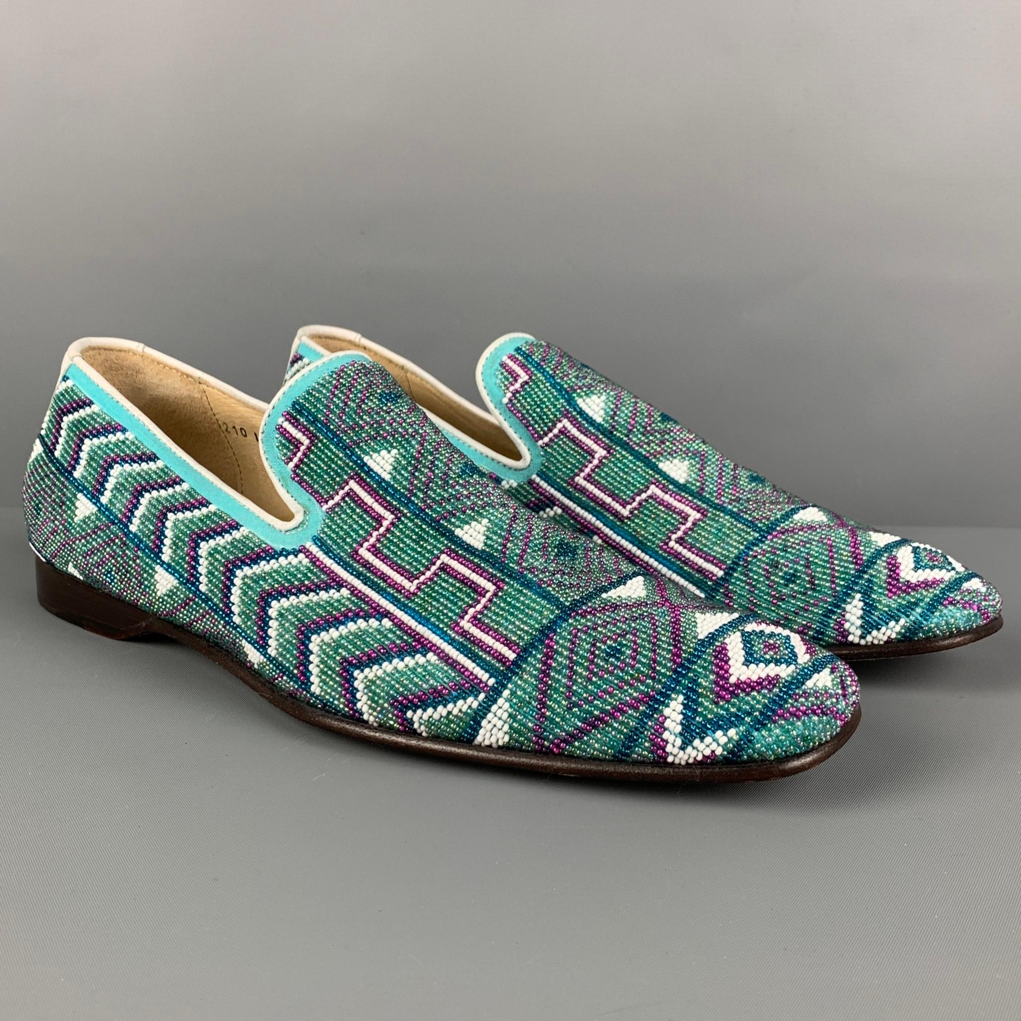 DONALD J PLINER loafers comes in a turquoise & purple beaded leather featuring a slip on style and a square toe. Made in Italy. 

Very Good Pre-Owned Condition.
Marked: 9 M

Outsole: 11.75 in. x 4 in. 