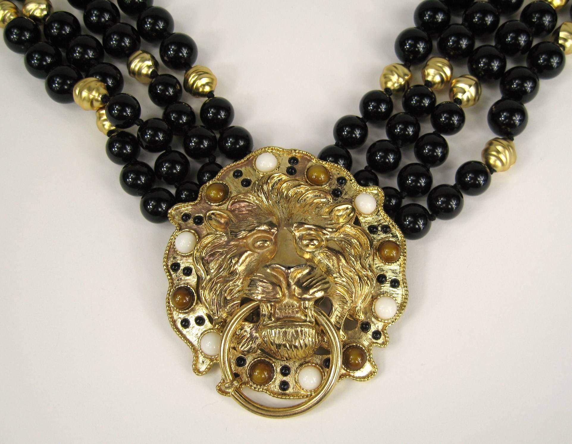Statement piece on this Stannard Necklace. 4 strand beads that are stationary to the Lions face. Measuring 3.20  x 3.05 and is approx. 17 inches necklace. Hang tag is hallmarked. This is out of a massive collection of Contemporary Fashion as well as