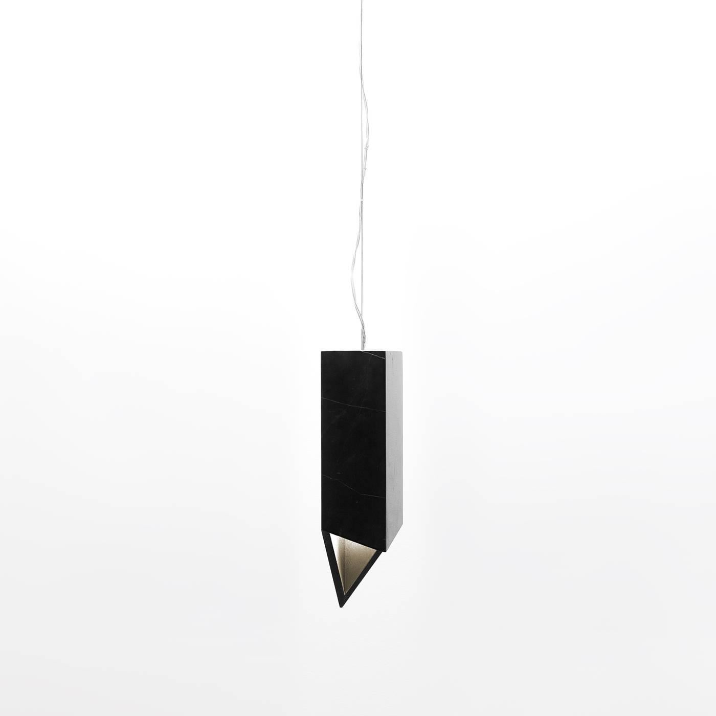 This Minimalist lamp, part of the Donatello collection and designed by Joe Gentile and Fabio Crippa of Studio ADL, is a timeless addition to an entryway, a dining room, or a living room and can be combined with the others in the same series for a