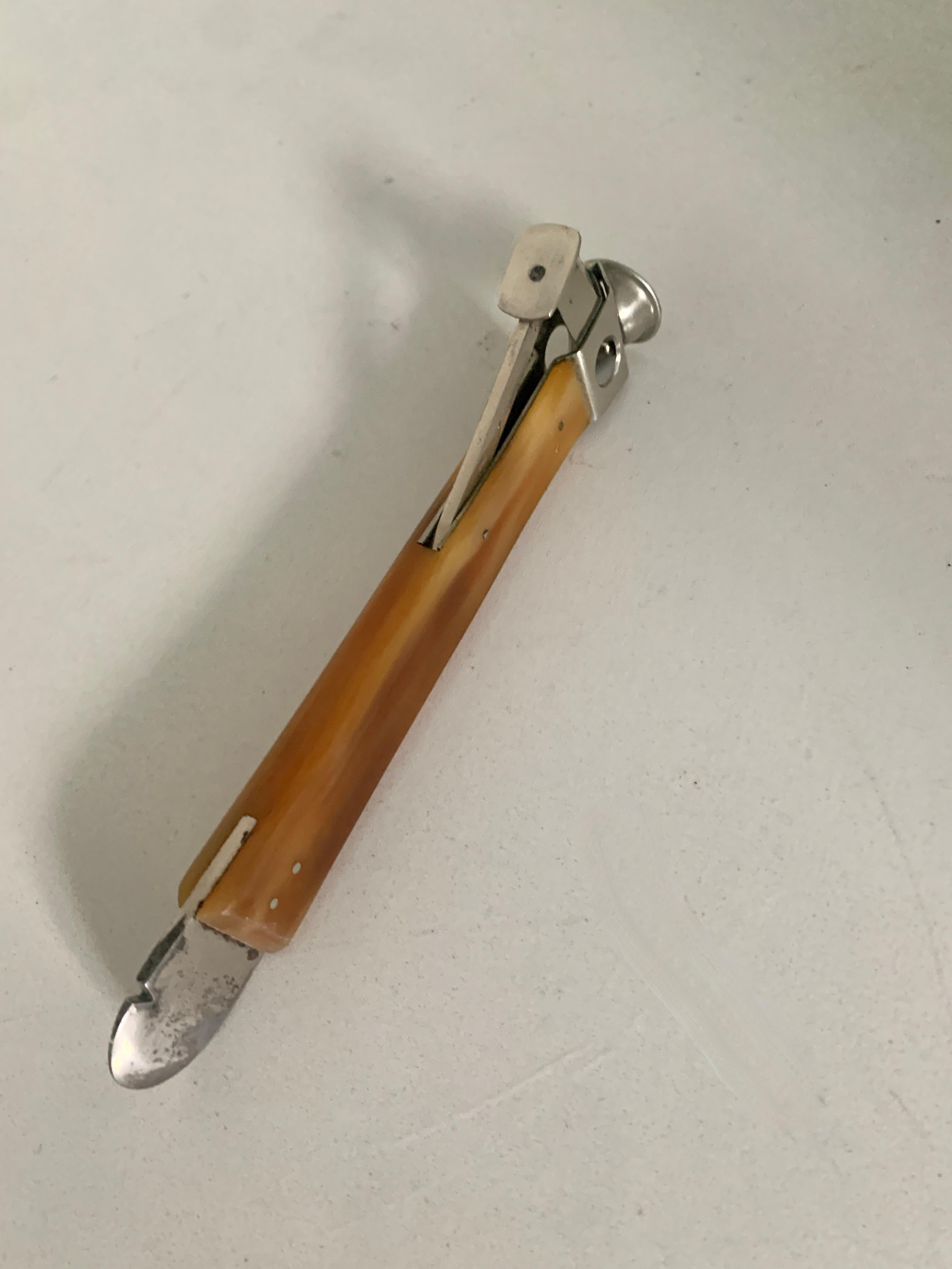 Donatus Solingen German cigar cutter with bone handle and box opener for the smaller cigar. This vintage piece has a bone handle and stainless metal opening allows for a 3/8