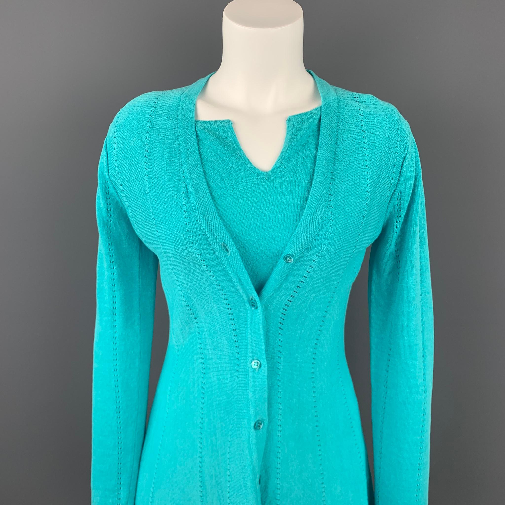 DONCASTER SIGNATURE cardigan 2 Piece set comes in a turquoise linen blend featuring a match short sleeve shirt and a buttoned closure. 

Very Good Pre-Owned Condition.
Marked: XS

Measurements:

-Cardigan

Shoulder: 17 in.
Bust: 34 in. 
Sleeve: 25