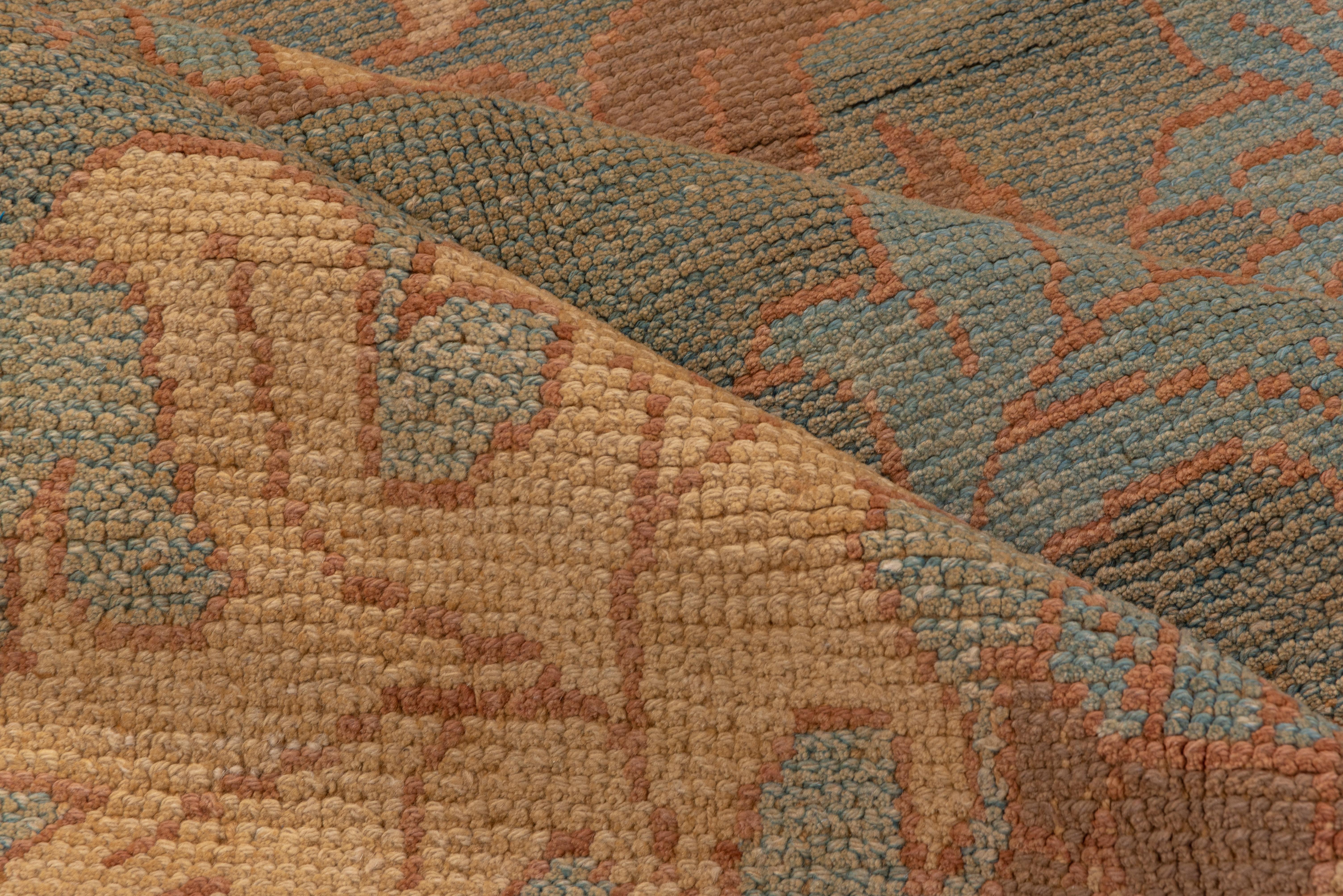 The basic color scheme is soft rust-red, Kelly green, pale green and buff-straw. The pattern consists of bold acanthus and ragged ivy leaves, and the plain border shares the field tone.