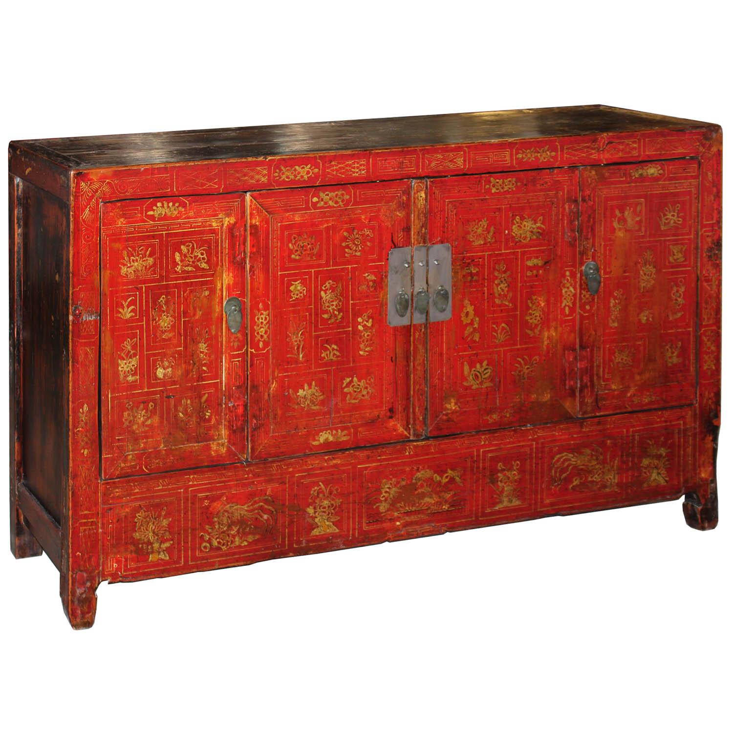 Place this elegant, bright red and gold buffet with hand-painted symbols for happiness, prosperity, and great blessings in the living room for pop of color. New interior shelf and hardware. Dongbei, China, circa 1920s.
