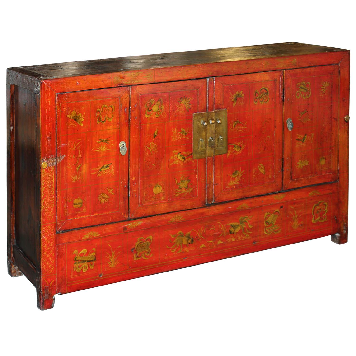 Four-door red lacquered wedding buffet with gold hand painted designs symbolizing prosperity, happiness and good fortune. New interior shelf and hardware. Made in Dongbei, China, circa 1890.