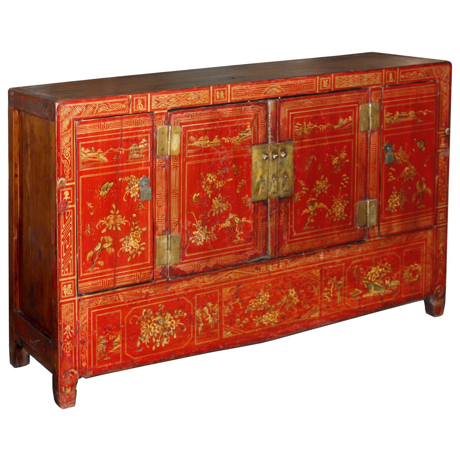 Red lacquer four-door wedding buffet with gold hand-painted designs symbolizing prosperity, happiness and good fortune. New interior shelf and hardware. Made in Dongbei, China, circa 1890. Some wear.
