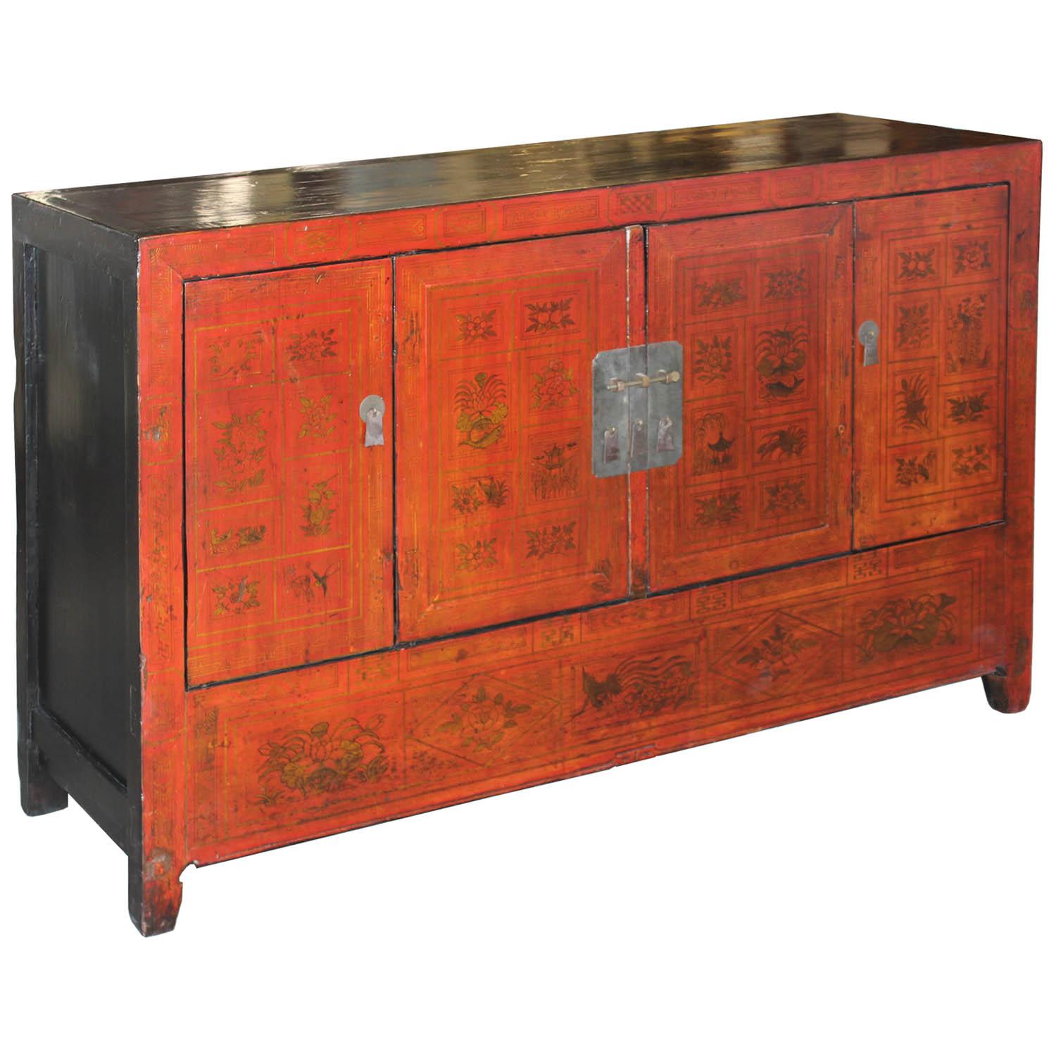 Unique red lacquer wedding buffet originally gifted to the bride and groom. Hand paintings of auspicious plants and flora depicting good fortune, happiness, and prosperity. New interior shelf and hardware. Dongbei, China, circa 1920s.