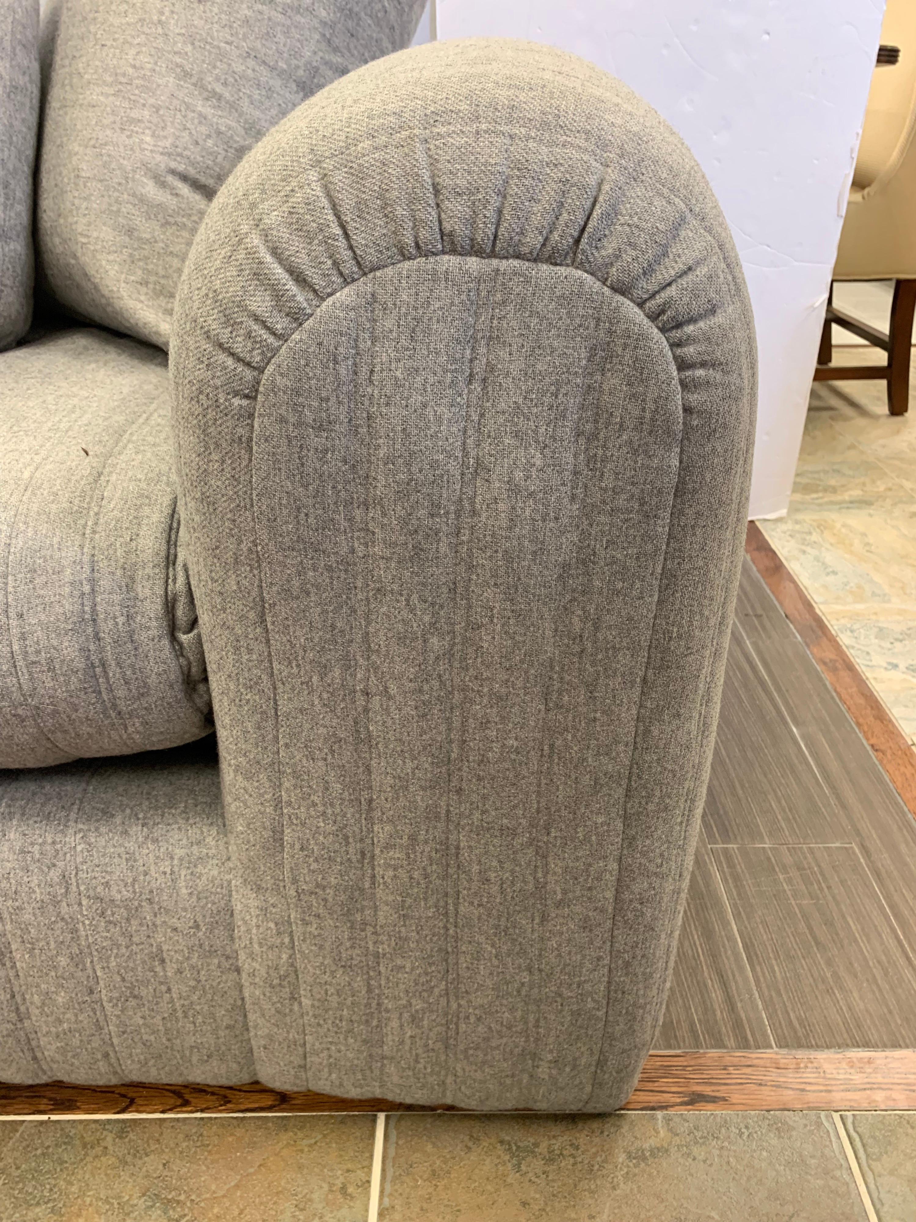 Stunning, large three-seat Donghia sofa designed by famed designer John Hutton. Upholstered in a soft wool blend fabric. Luxurious and super comfortable. See our other listing for coordinating sofa. 