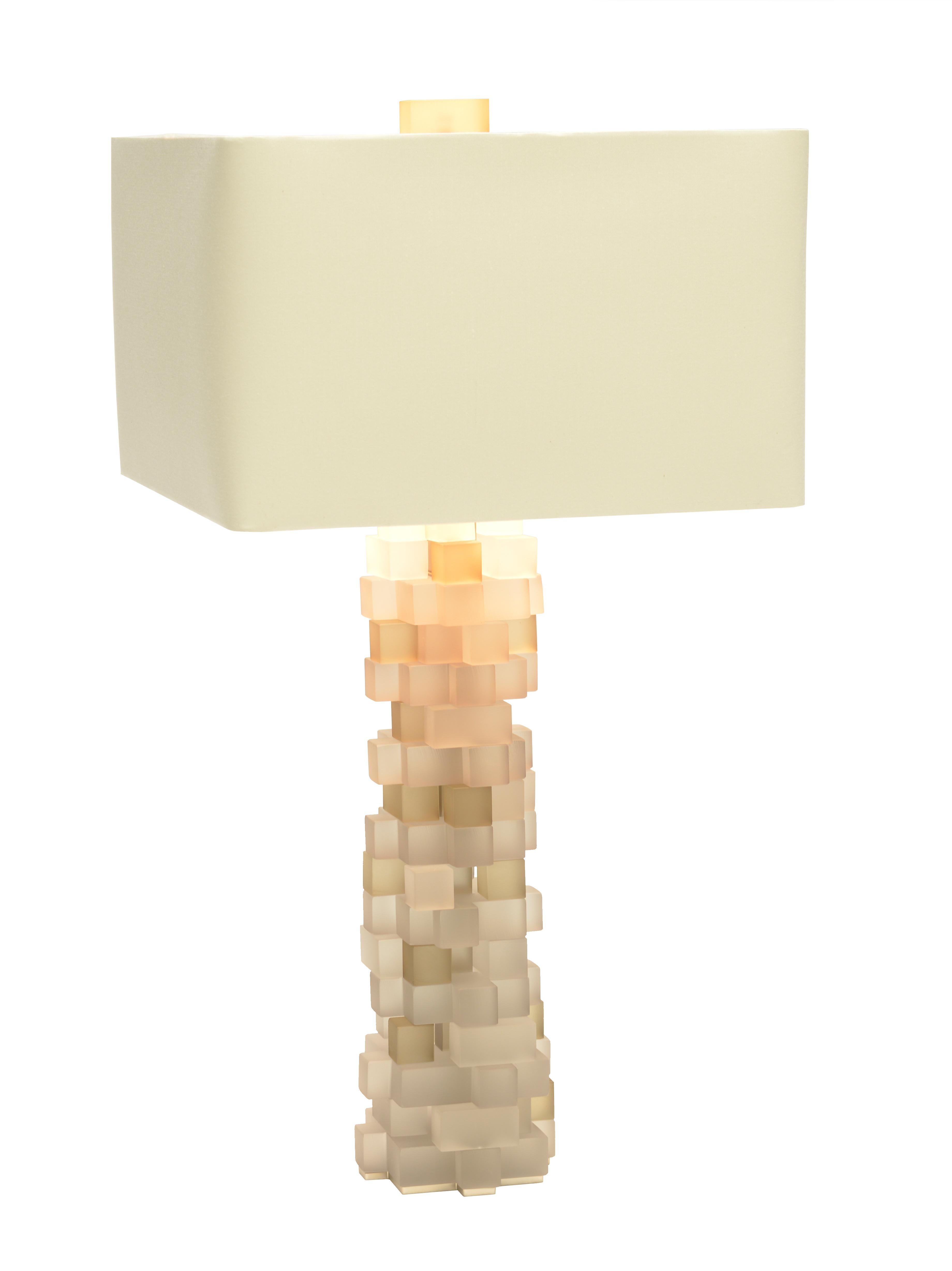 Druzy is cut from handmade Venetian clear glass blocks and stacked into a mineral-like formation. The collection emits the perfect balance of light through its interplay of geometric forms. A lavishly detailed lamp that is a true jewel for the home.
