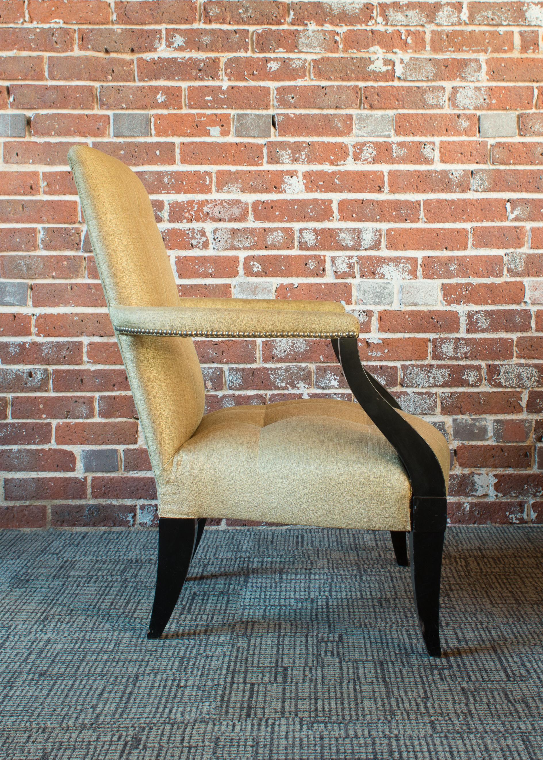 An intriguing juxtaposition of lines and curves, this occasional chair offers square seaming details and shallow tufting on tight inside seat and inside back.
Fabric is a timeless silk.
Nail head details on arms in antiqued brass bring to mind a