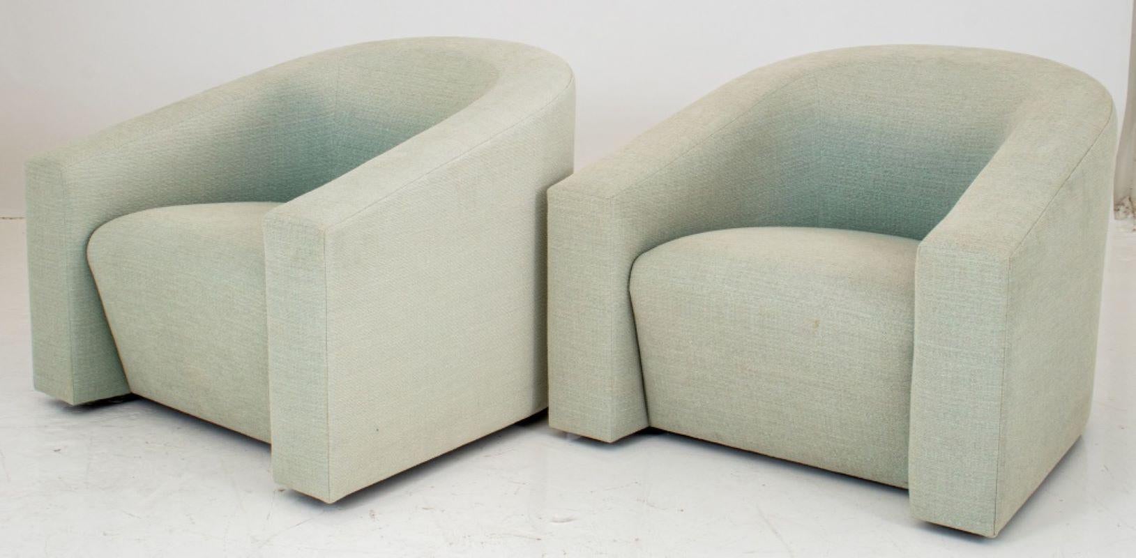 Donghia Italian Modern pair of lounge armchairs with cascading armrests on swivel bases, upholstered in a light celadon green, makers label on bottom. 29