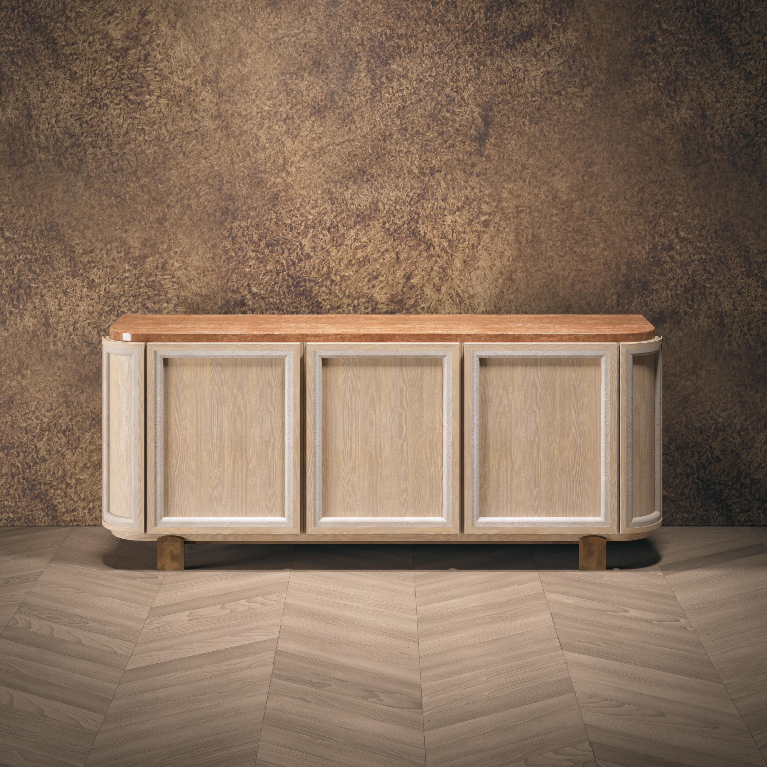 ‘Döngü’ is a simple yet sophisticated sideboard, a spacious storage space
 with a mother-of-pearl wood finish, and delightfully crafted handles with
our signature touch; the leather patterned lacquer.
Material & Finish
Body: Oak veneer
Top: