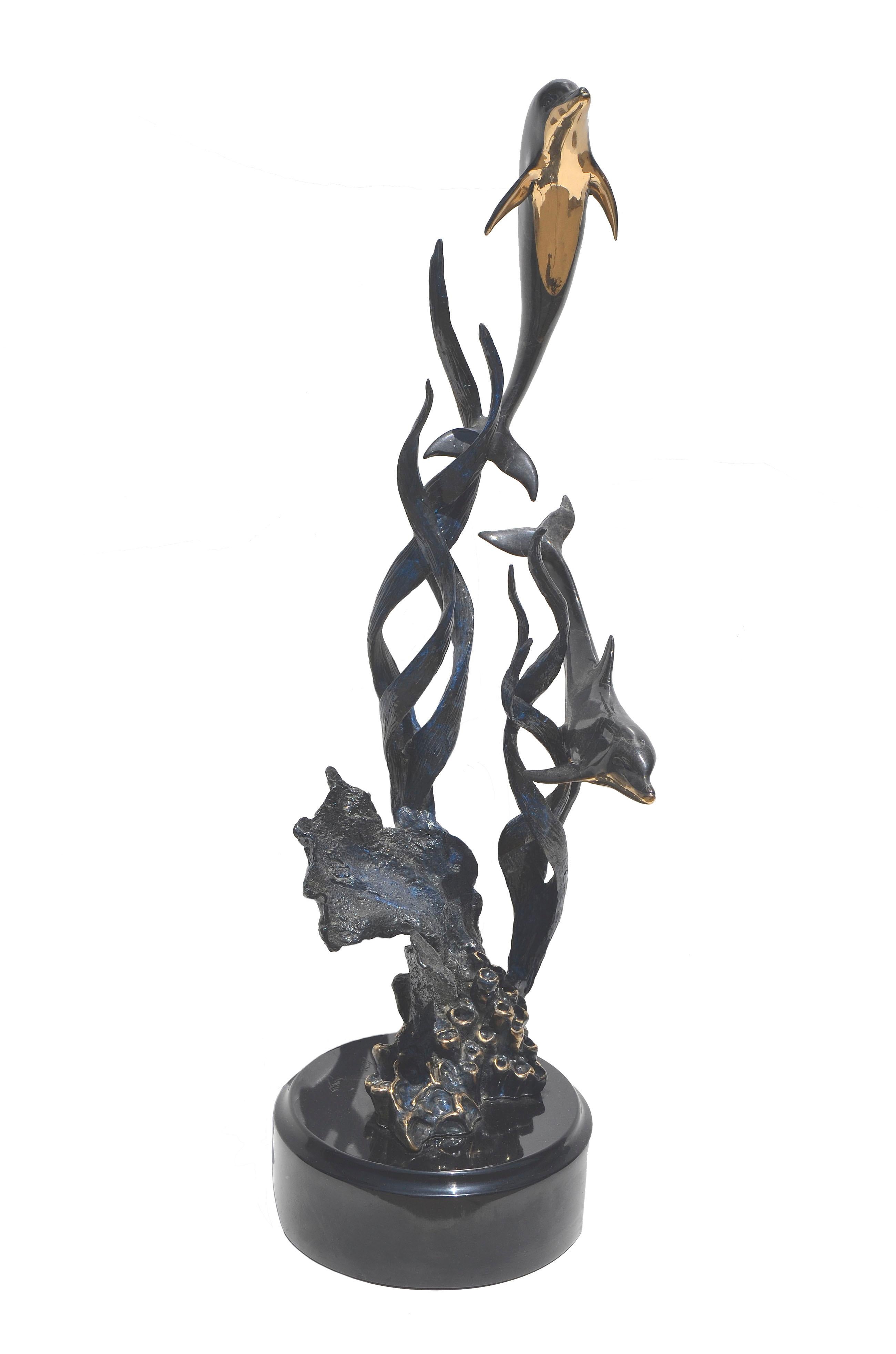 Beautiful bronze sculpture of two dolphins swimming in a kelp and coral environment. Beautiful viewing 360 degrees. Presented on a black lacquer base. Artist's signature and edition number etched into base: 