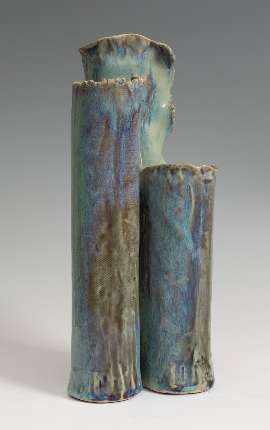 Donna craven, 1983 glazed enameled abstract earthenware pottery vase with three main organic recipients reminiscent of plants stalks.
   