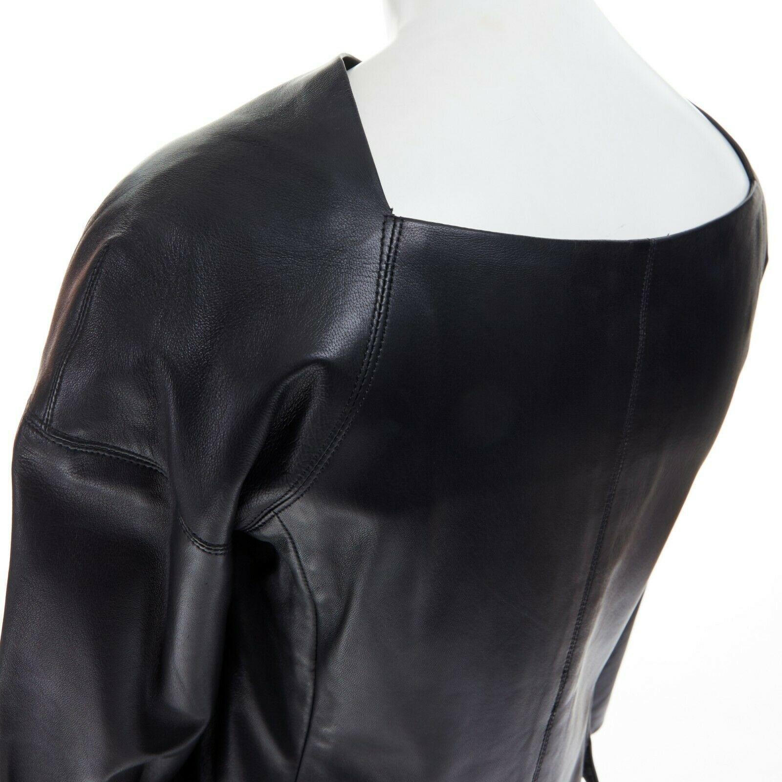 DONNA KARAN 100% lambskin leather wide angular neckline 3/4 sleeves top US4 S
DONNA KARAN
100% lambskin leather. 
Black. 
Wide. 
Angular cut at back of neck. 
Dropped shoulder seam. 
3/4 sleevses. 
Off center concealed zip closure. 
Fully lined.