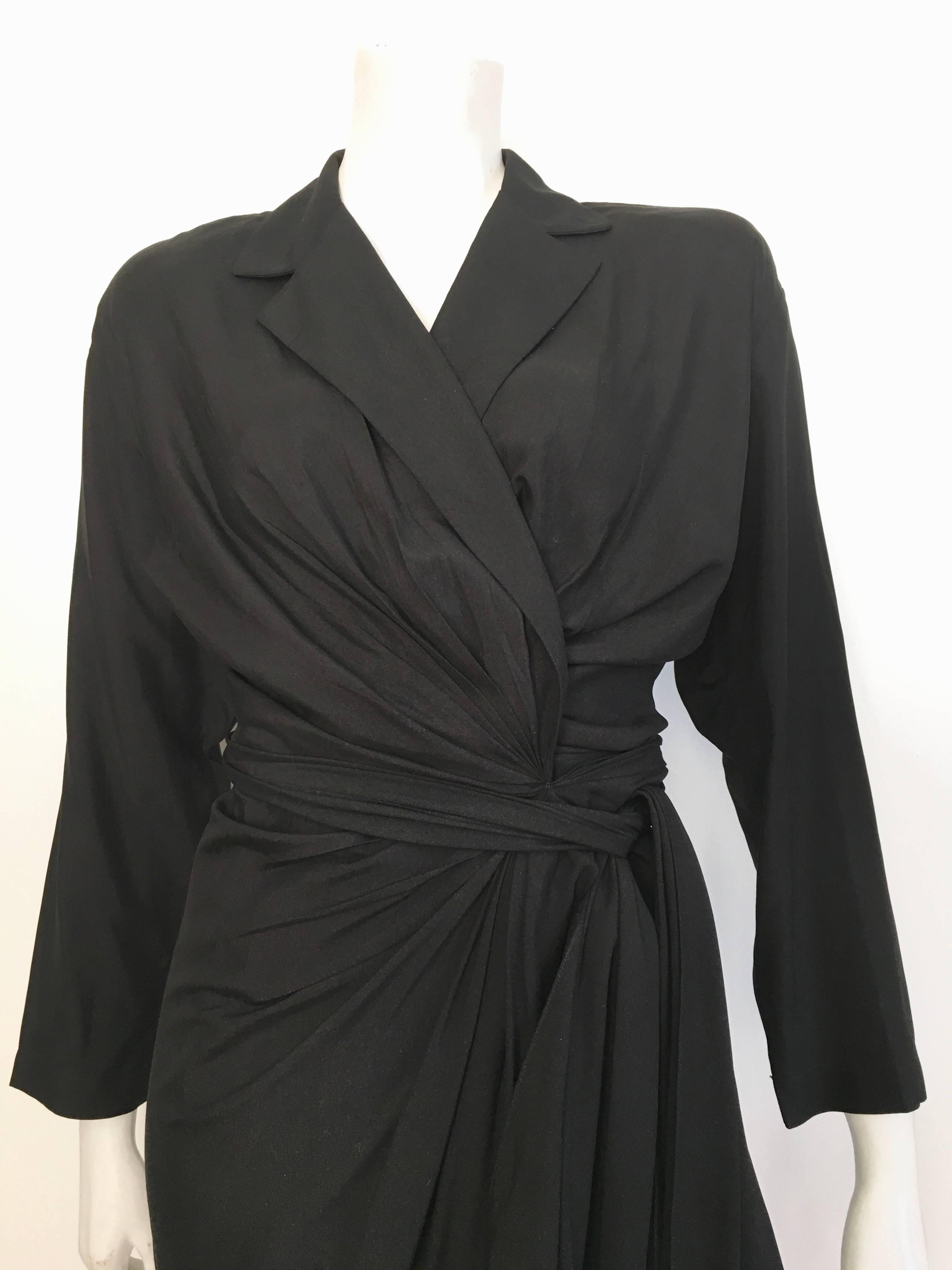 Donna Karan New York 1980s black silk wrap dress is labeled a size 10 but fits like a size 8.  The waist is 31