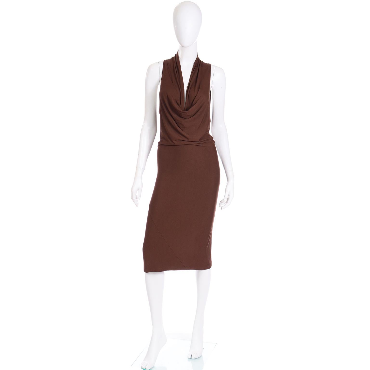 We always love finding older vintage Donna Karan pieces! This is a gorgeous early 1990's Donna Karan brown stretch jersey dress with a low plunging draped neckline and pintucked front. This minimalist dramatic dress slips overhead with no closures