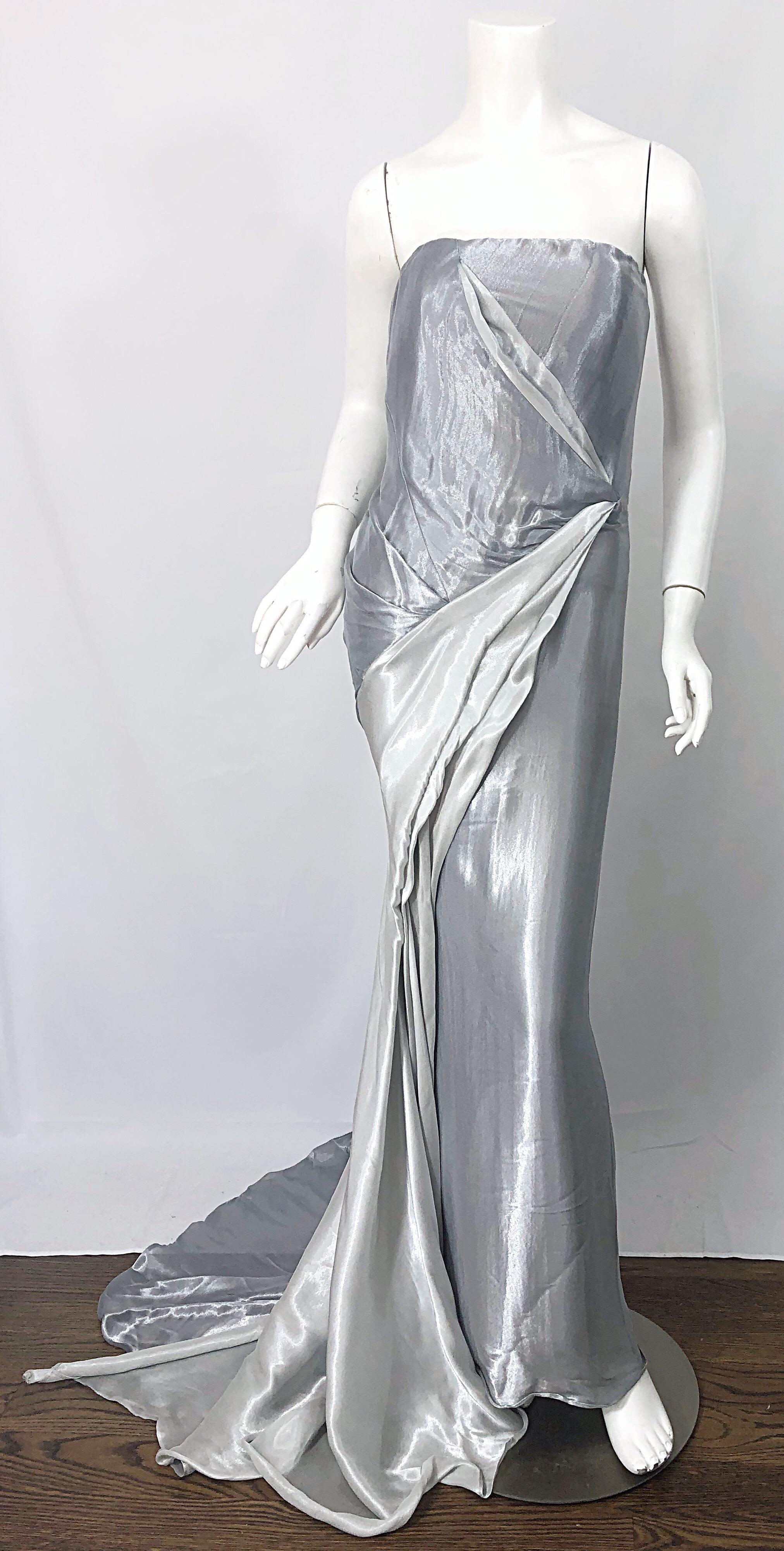 Gorgeous vintage DONNA KARAN silver metallic strapless Grecian gown! Features a boned fitted bodice, with flattering drapes and gathers throughout. Hidden zipper up the back with hook-and-eye closure. Fantastic long train. The perfect evening dress