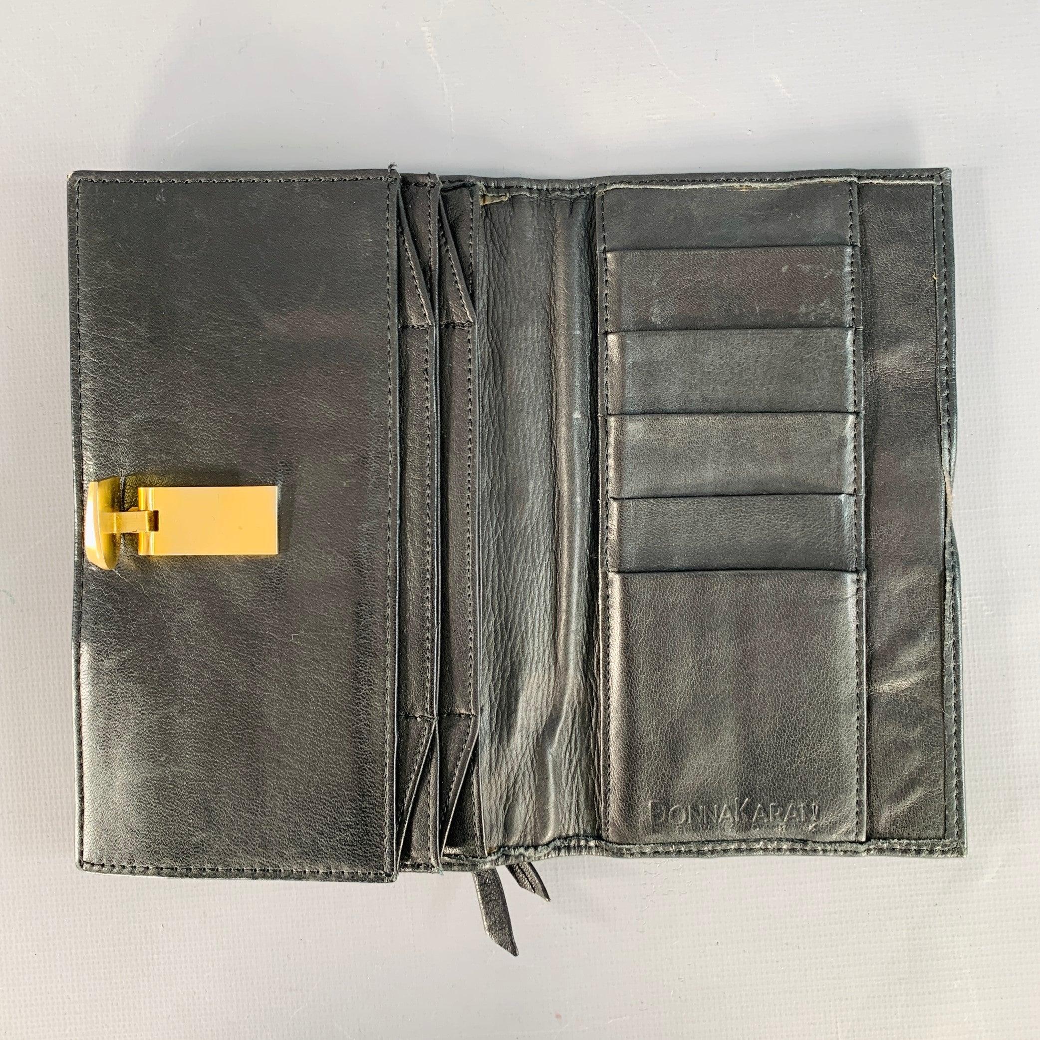 DONNA KARAN Portefeuille en cuir noir et or Bon état - En vente à San Francisco, CA