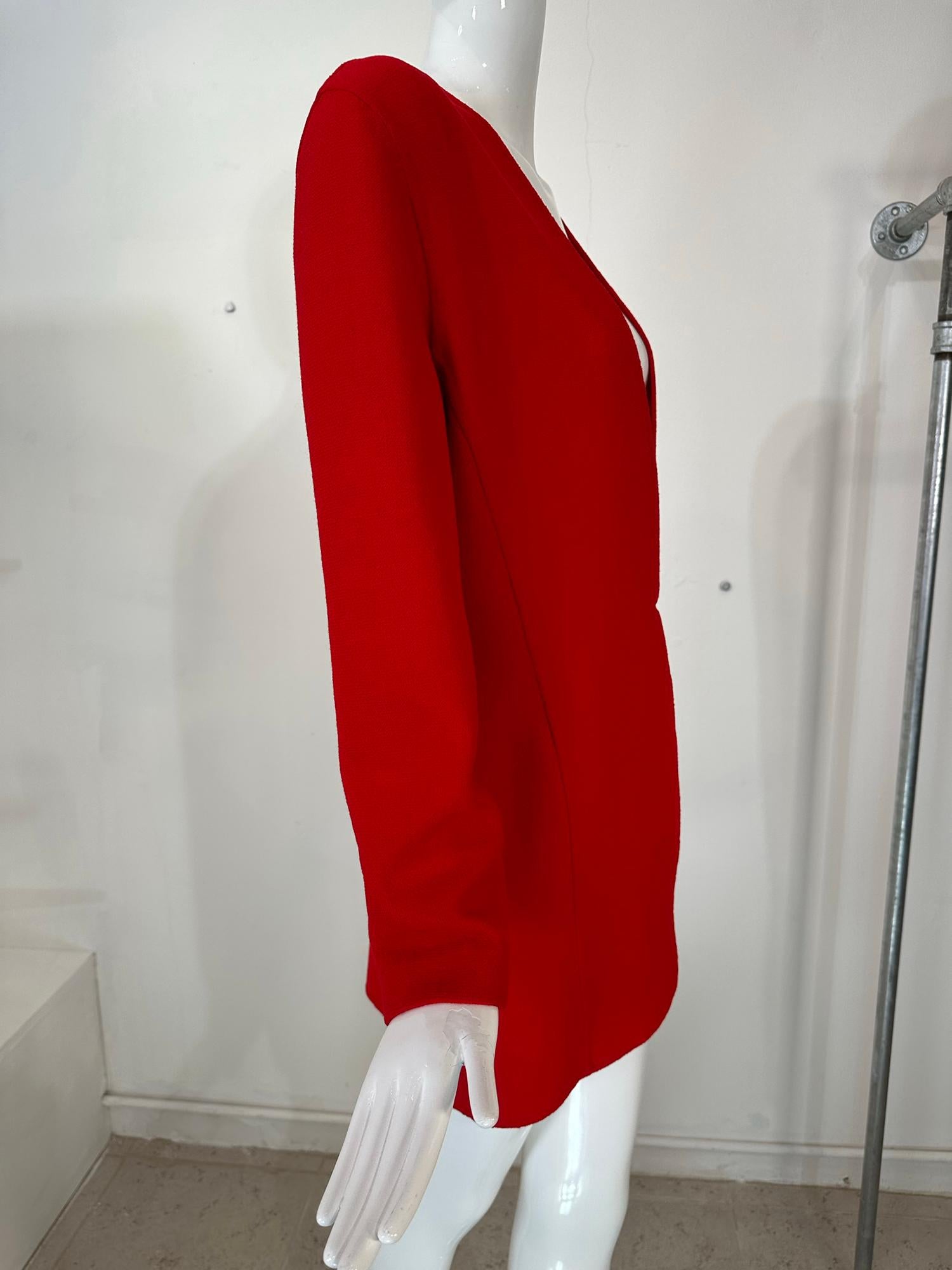 Donna Karan black label fire engine red princess seam, double face wool jacket from the 1990s. Plunge V neck jacket closes at the lower waist with hidden hook & self loop. Below hip length jacket is unlined. Drop shoulder with padded shoulders. Flat