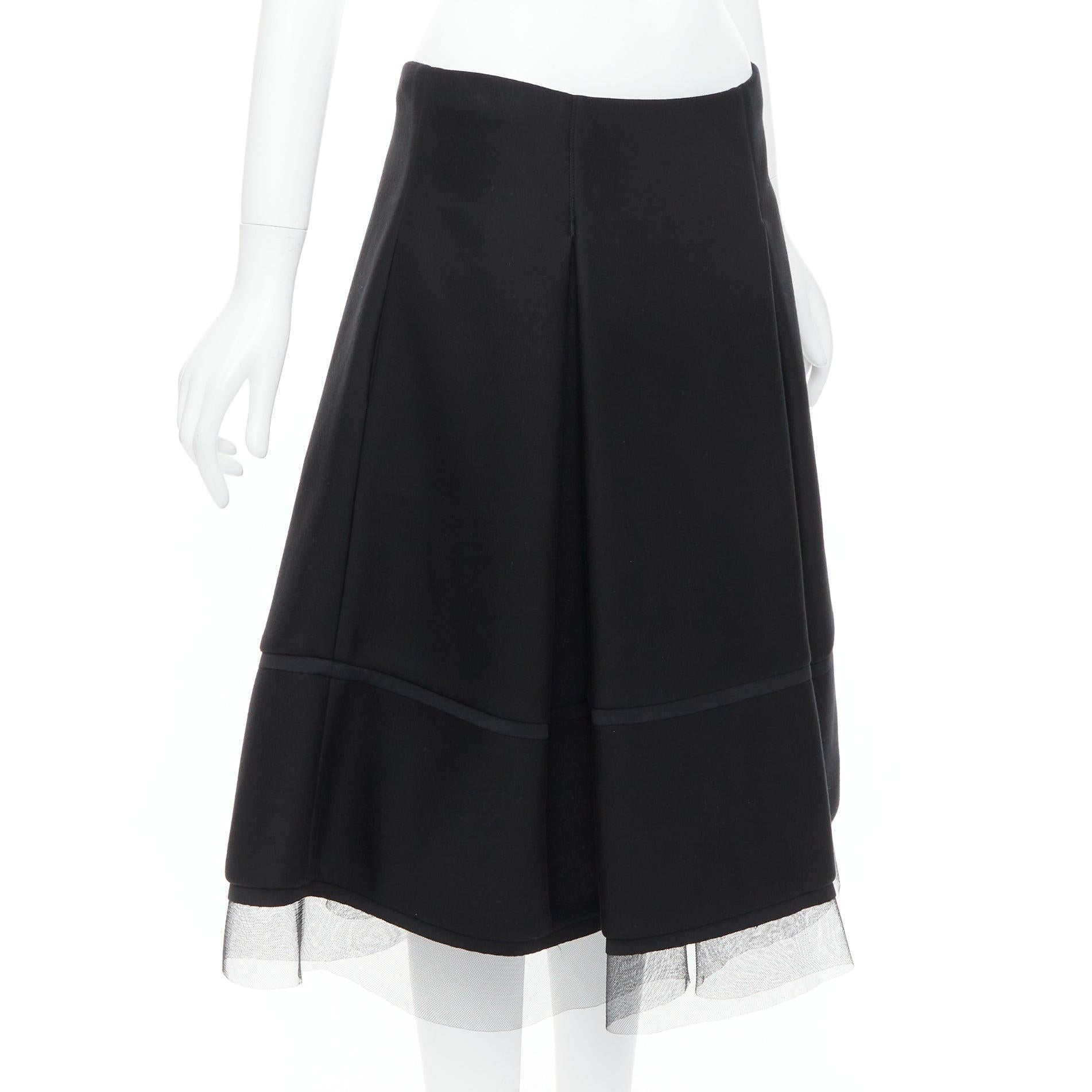 Nero DONNA KARAN gonna a ruota in scuba nera, plissettata e con rifiniture in tulle a rete FR40 L. in vendita