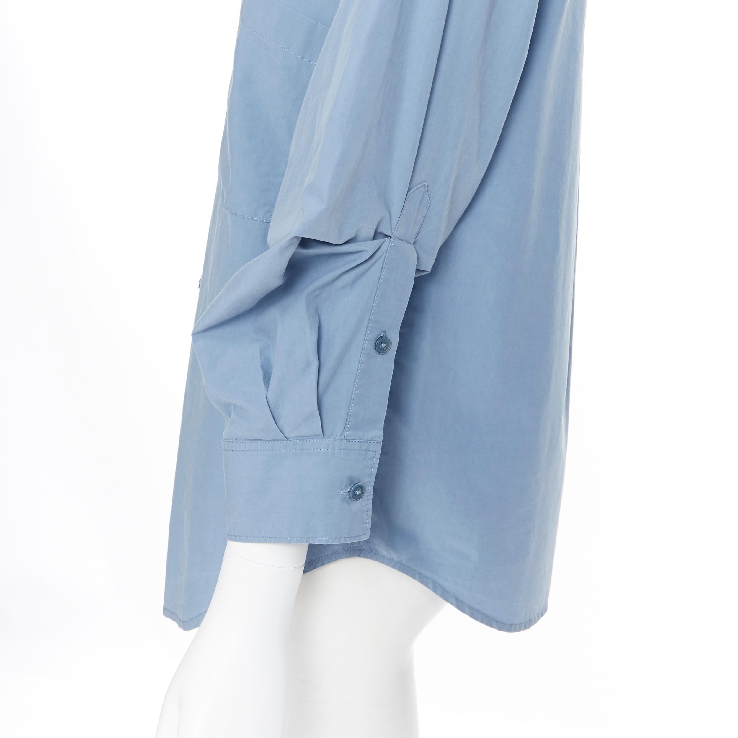 DONNA KARAN blue cotton oversized boxy nipped 3/4 sleeves casual shirt XS
Brand: Donna Karan
Designer: Donna Karan
Model Name / Style: Boxy shirt
Material: Cotton
Color: Blue
Pattern: Solid
Closure: Button
Extra Detail: Nipped detail on cuff for