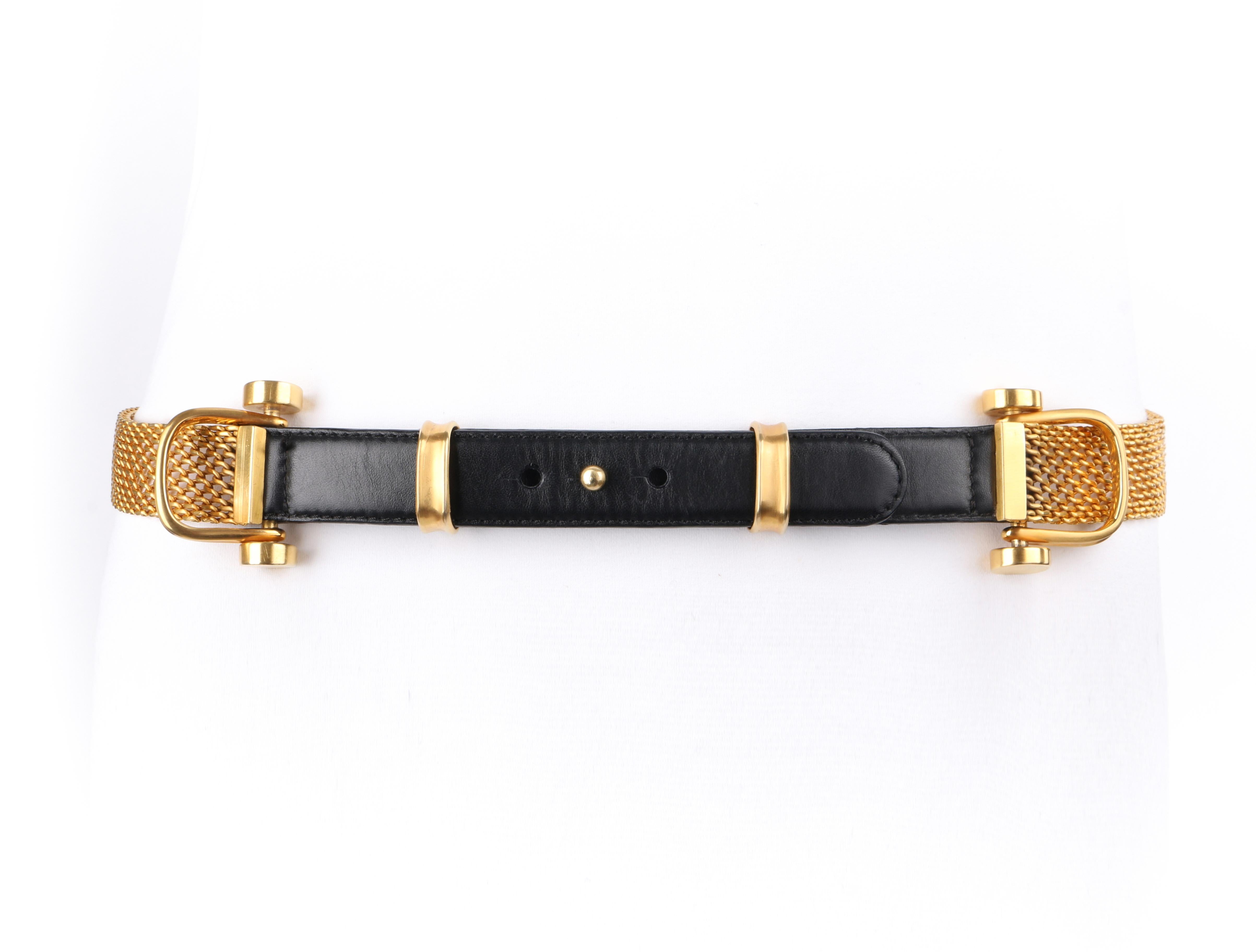 DONNA KARAN c.1990s Black & Gold Leather Chainmail Pin Front Waist Belt 

Circa: 1990’s
Label(s): Donna Karan New York
Designer: Donna Karan
Style: Waist belt
Color(s): Black (belt), shades of gold (hardware)
Marked Fabric Content: “Genuine Leather”
