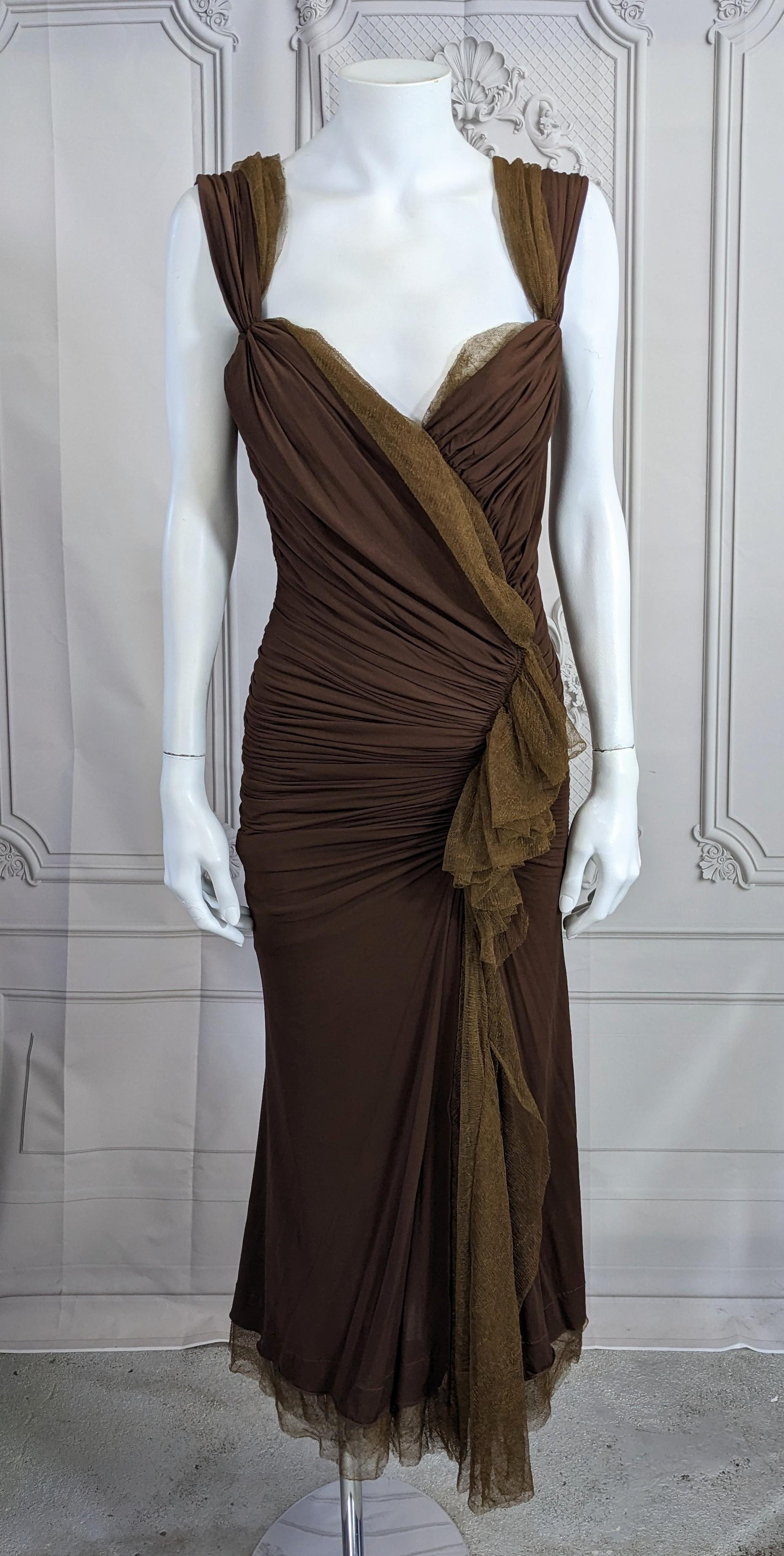 Donna Karan Collection's Sexy Draped Jersey Dress in deep chocolate stretch rayon jersey with greenish gold knit tulle cascade. Donna Karan gowns are seemingly simple in cut but are actually quite complicated.
The dress is lined in both the gold