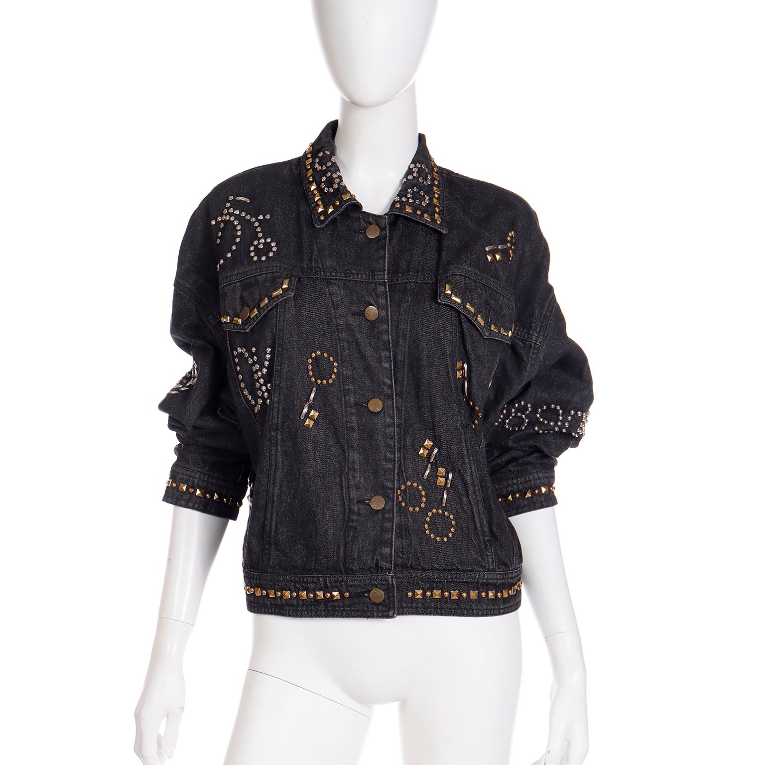 We sometimes run across very early DKNY pieces that are pretty spectacular, but this jacket has to be one of our favorites! This black washed denim jacket is embellished with gold and silver metal studs that form novelty shapes and words. Bicycles,