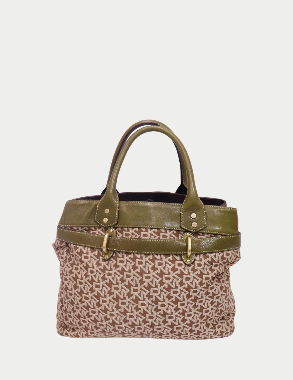 DKNY Monogram Canvas Handbag with Olive Green Leather Trim

Add a sophisticated statement to your everyday wardrobe with this DKNY handbag in classic brown monogram canvas. Featuring DKNY’s signature logo print, this structured bag is accented with