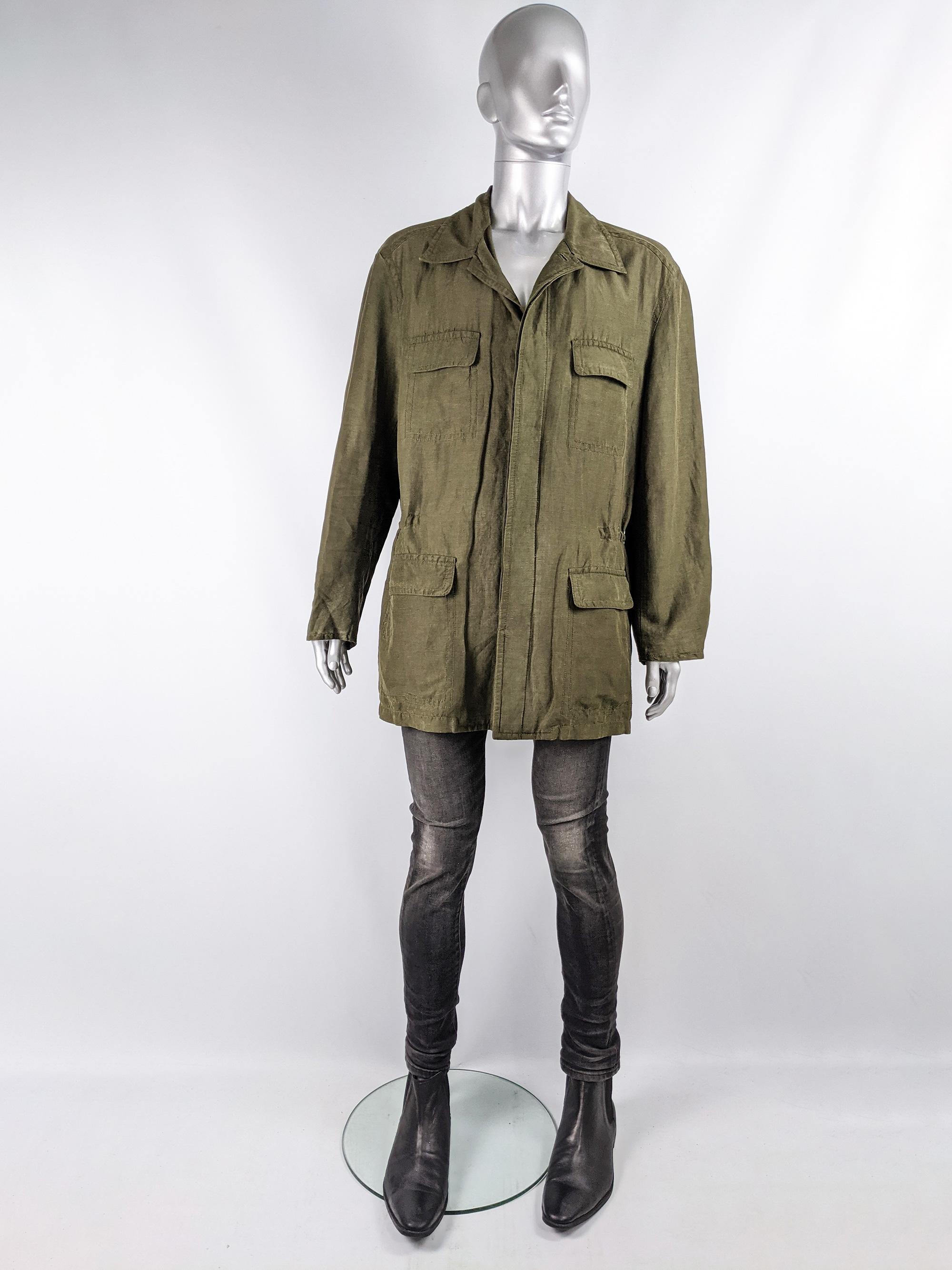 An excellent vintage mens jacket from the 90s by luxury American fashion designer, Donna Karan for her mainline. In a military green silk and linen blend with a drawstring on the inside that pulls in the waist for a more flattering shape and four