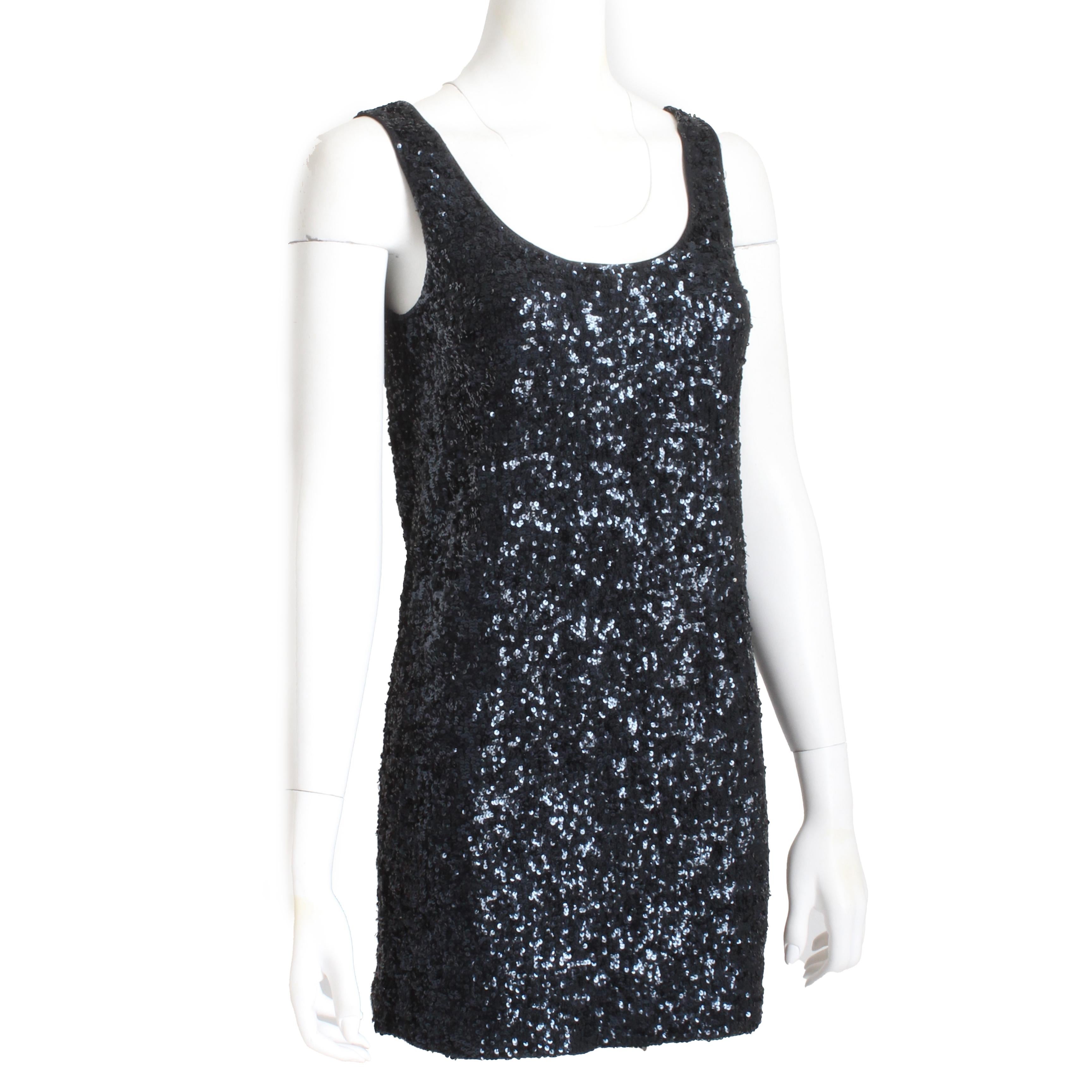 Authentic, preowned, vintage Donna Karan New York cocktail or party dress, likely made in the 90s. Made from a stretchy silk knit, it's covered in black sequins throughout, which shimmer and shine in certain light! 

Incredibly chic and sexy, this