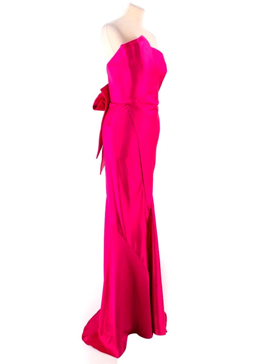 Donna Karan Pink Mikado Silk Gown

- Bow gathered detailing on the back 
- Resort Collection 2013
- Strapless
- Asymmetric bust
- Maxi Length
- Hook & Eye and zip closure

please note: these items are pre-owned and may show signs of being stored