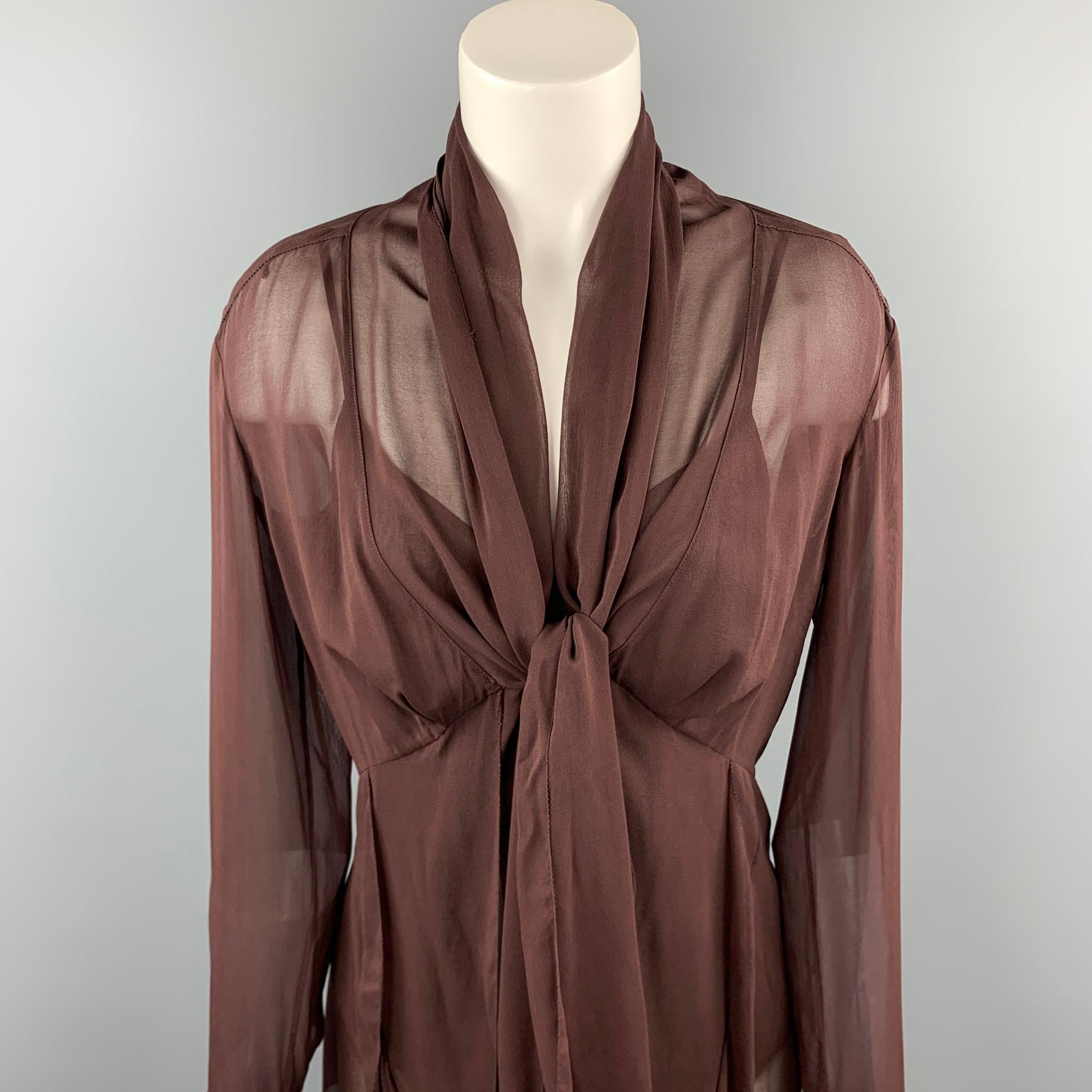 DONNA KARAN blouse comes in a burgundy  silk / elastane featuring a tie up style, buttoned sleeves, and includes a camisole top.

Good Pre-Owned Condition.
Marked: No size marked

Measurements:

Shoulder: 17 in. 
Bust: 38 in. 
Sleeve: 26 in.