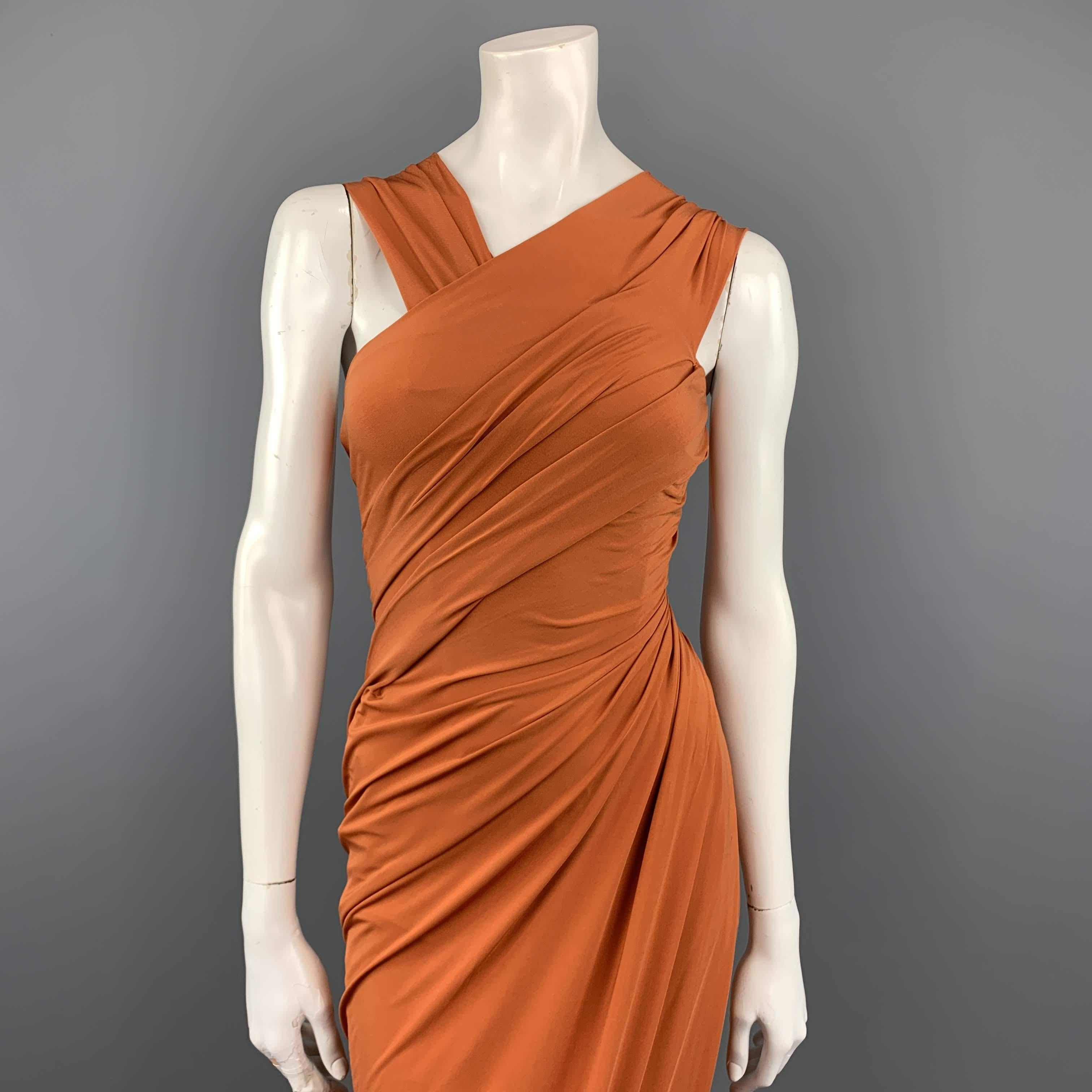 DONNA KARAN gown comes in gorgeous burnt orange stretch jersey knit with three thick straps and asymmetrical draped sheath silhouette. Made in USA.
 
Excellent Pre-Owned Condition.
Marked: (no size)
 
Measurements:
 
Bust: 36 in.
Waist: 28 in.
Hip: