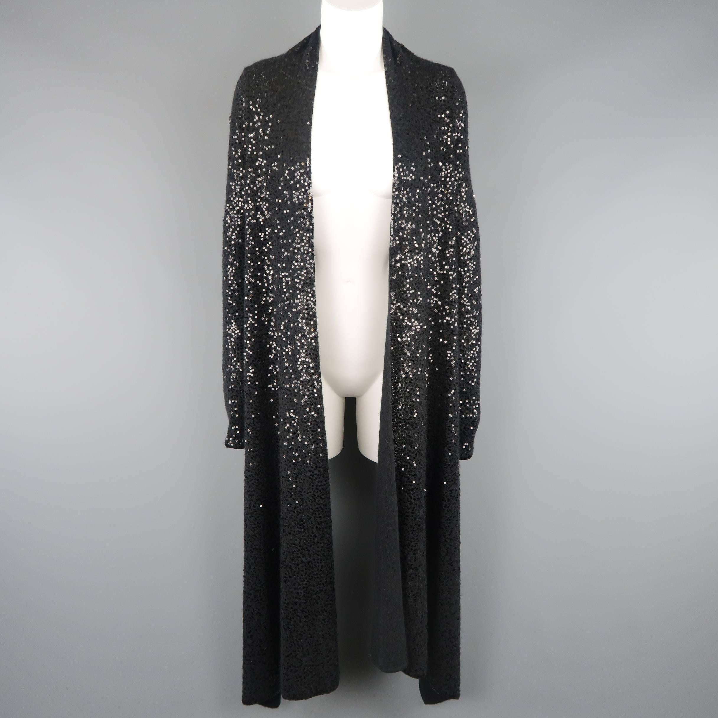 DONNA KARAN Black Label cardigan comes in black sequined cashmere silk blend knit with an open front, extended draped collar, and short back.
 
Good Pre-Owned Condition.
Marked: S
 
Measurements:
 
Shoulder: 16 in.
Bust: 38 in.
Sleeve: 22