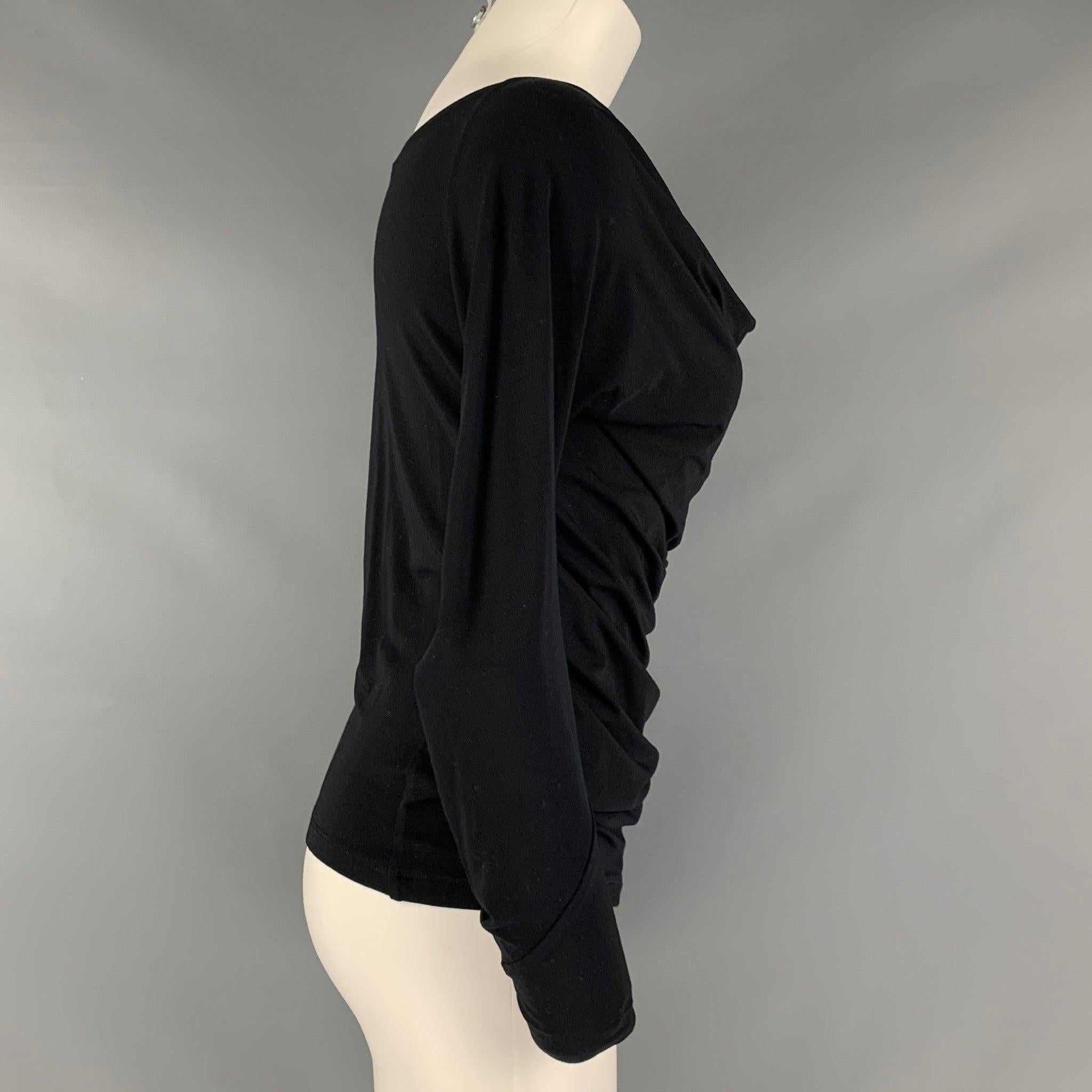 DONNA KARAN pullover comes in a black viscose and elastane knit material featuring a draped neckline, and long sleeve.Very Good Pre-Owned Condition. Moderate signs of wear. 

Marked:   S 

Measurements: 
 
Shoulder: 18 inches Bust: 39 inches Sleeve: