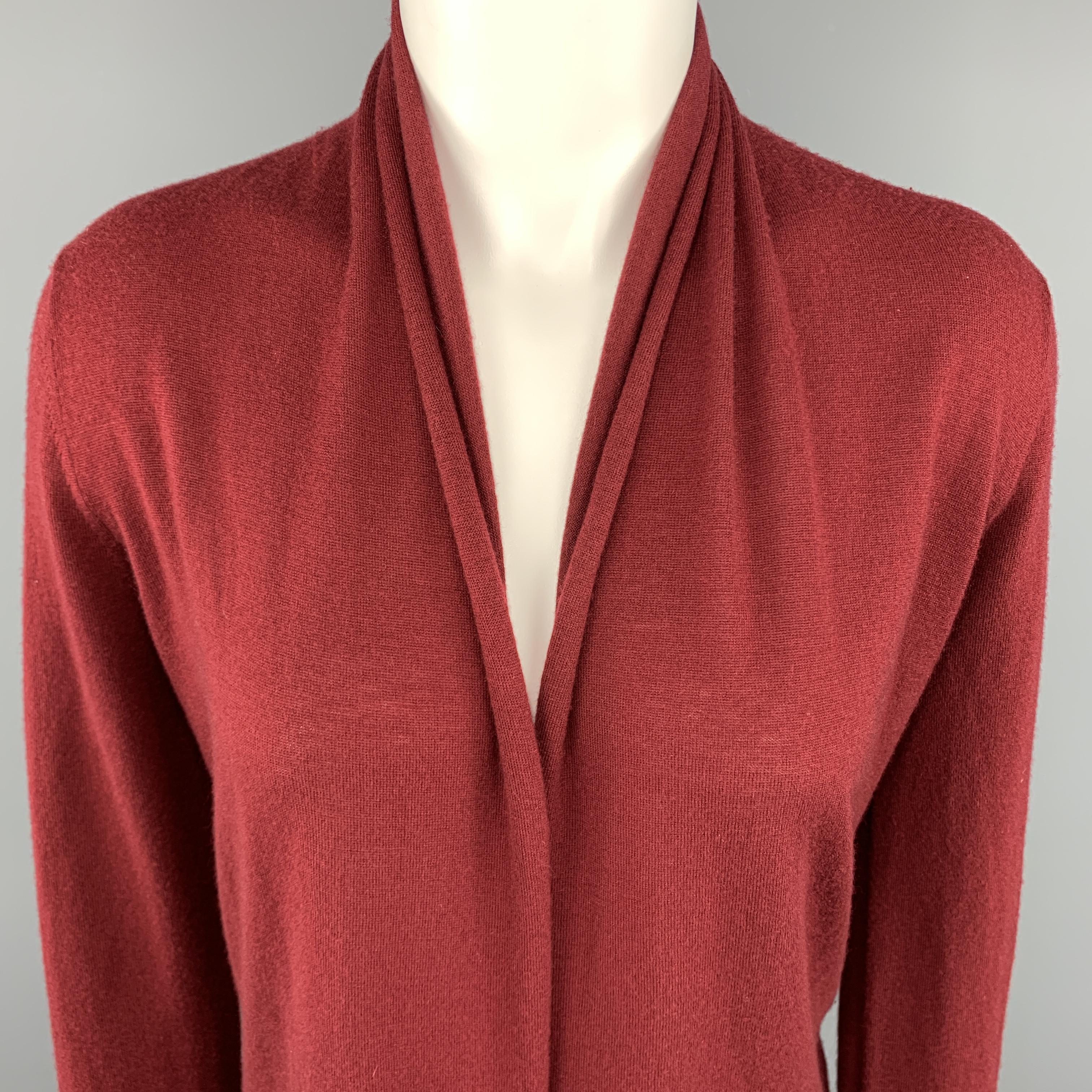 DONNA KARAN Cardigan Sweater comes in a burgundy tone in a solid knitted cashmere material, Open Front, with raw hems and long sleeves. Minor wear at back.
 
Very Good Pre-Owned Condition.
Marked: S
 
Measurements:
 
Shoulder: 15.5 in.  
Bust: 34