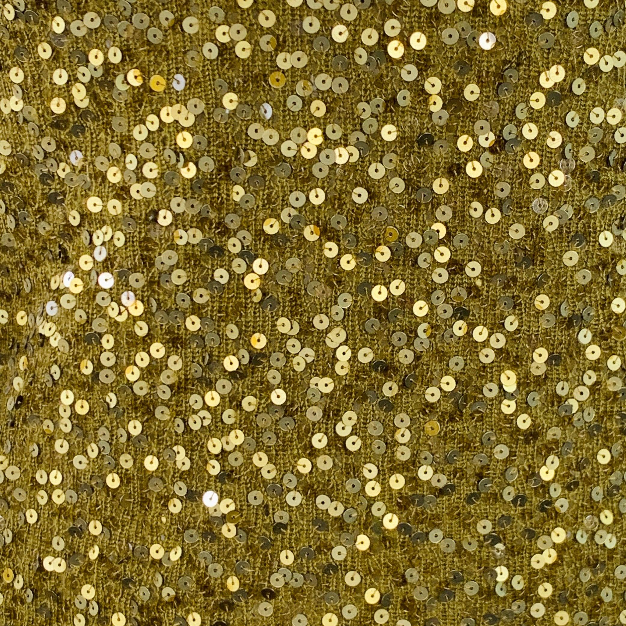 DONNA KARAN pullover
in a gold tone and olive green cashmere silk blend knit featuring an all over sequined design, long sleeves, and V-neck. Good Pre-Owned Condition. Moderate pilling and signs of wear. 

Marked:   S 

Measurements: 
 
Shoulder: 13