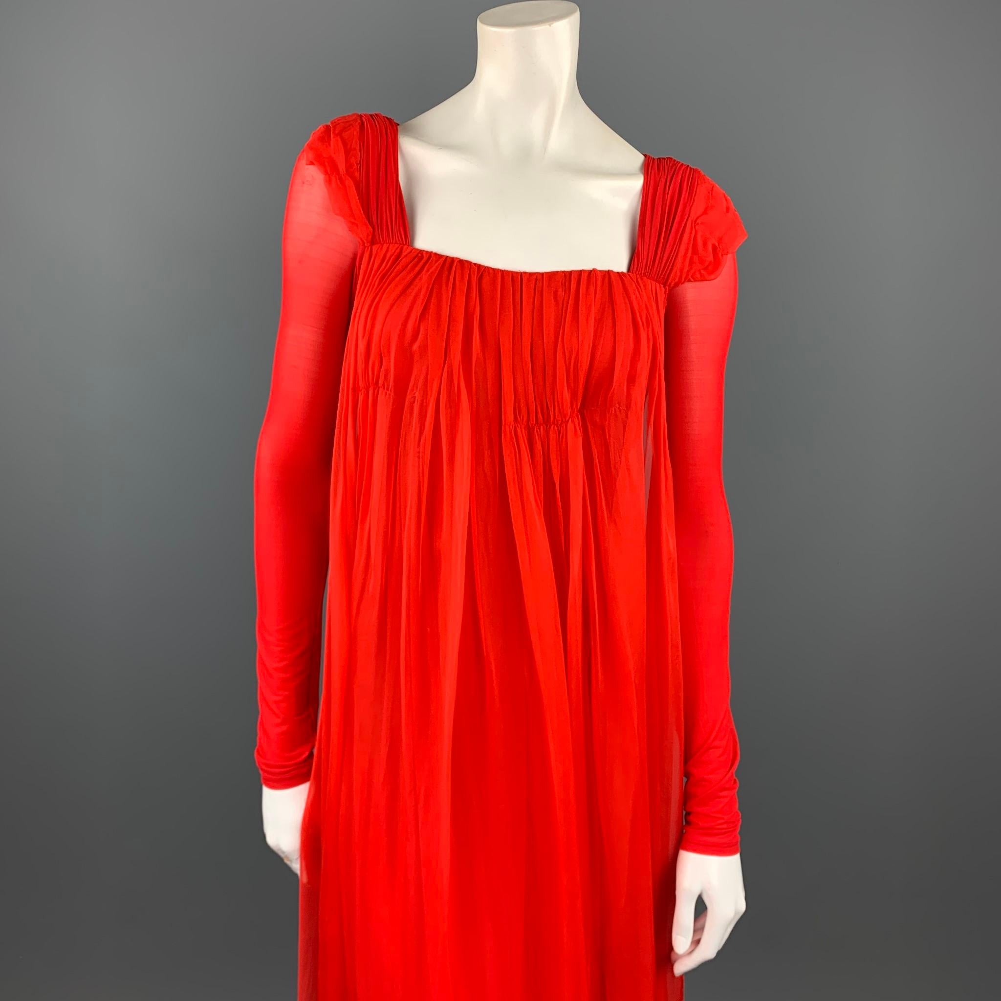 DONNA KARA evening gown comes in a red cupro blend featuring a silk overlay detail, padded shoulders, elastic waistband, and a ruched back design. As-Is. Made in Italy.

Good Pre-Owned Condition.
Marked: No size marked

Measurements:

Shoulder: 16.5