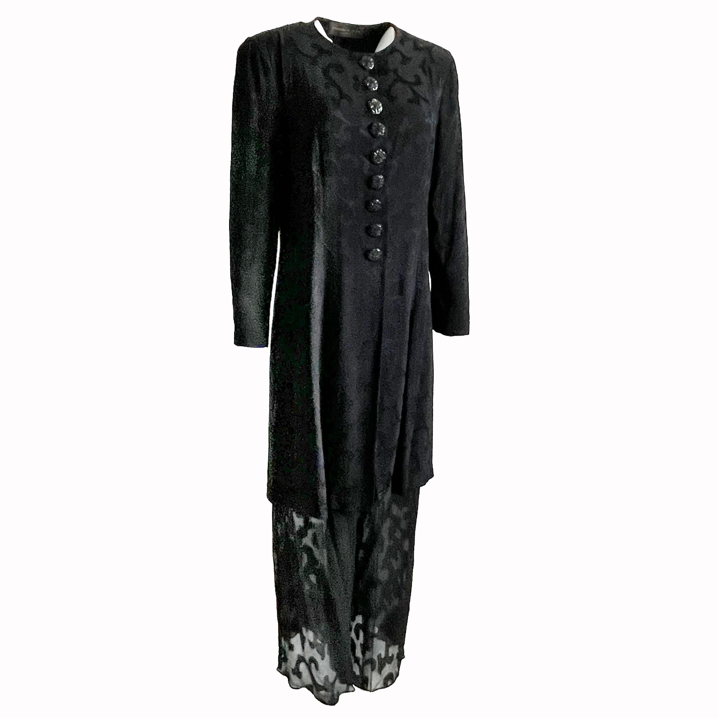Here's a chic two-piece jacket and pants set from Donna Karan New York, and sold by high end luxury retail center LEONE in British Columbia, most likely in the 1990s. Made from black silk, the jacket features a floral brocade pattern throughout with