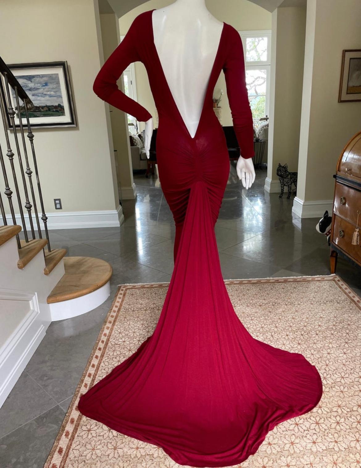 
Donna Karan Vintage Red Jersey Fishtail Evening Dress with Plunging Back .
New with tags.
This is so pretty.
Size S, there is a lot of stretch.
Bust 34