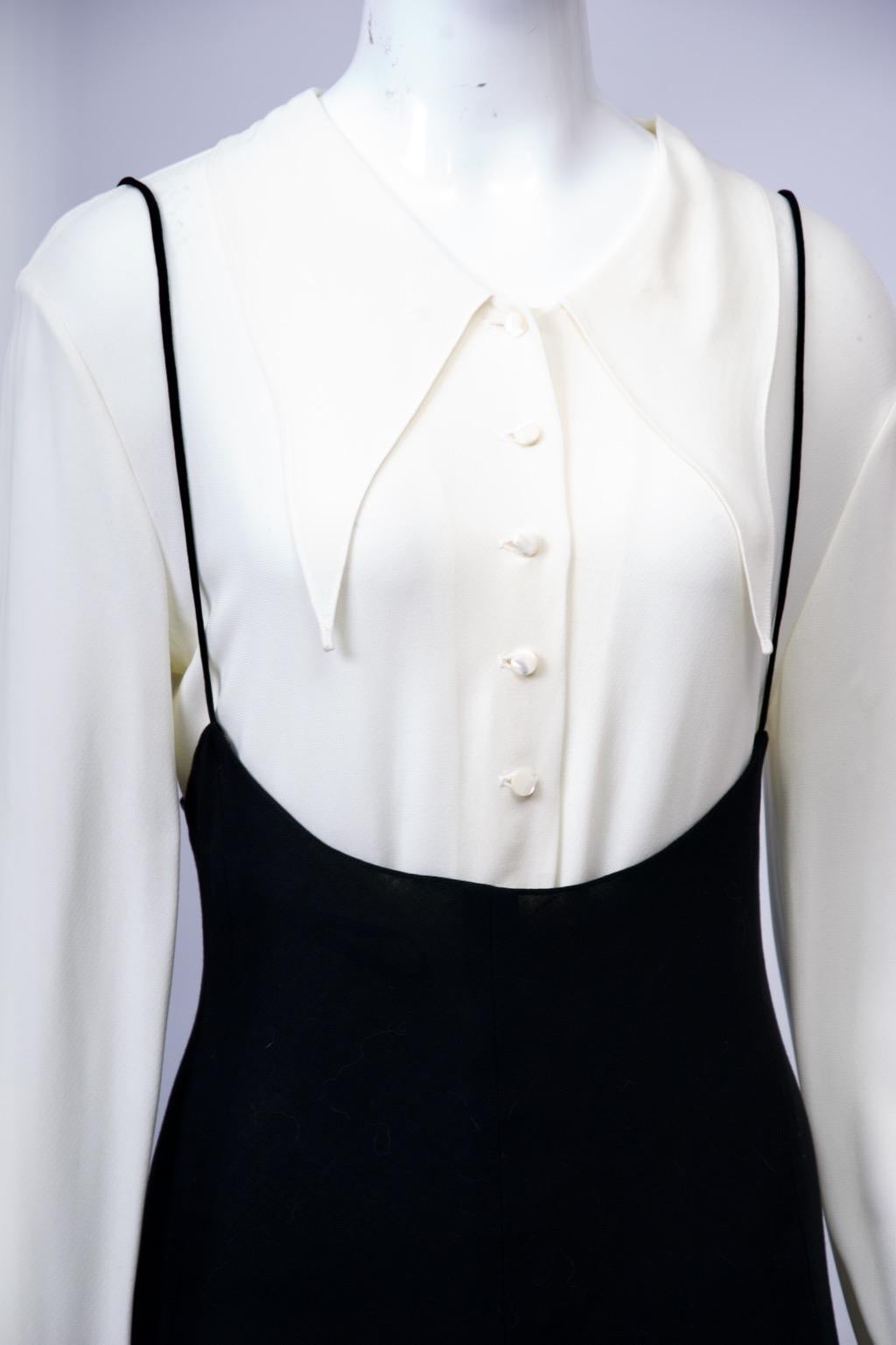 Donna Karan vintage ensemble, c.1990s, incorporating her signature designs - the bodysuit and the simple black shape. Here the bodysuit is a romantic white blouse featuring a large pointed collar with tiny pearl buttons down the front and long full