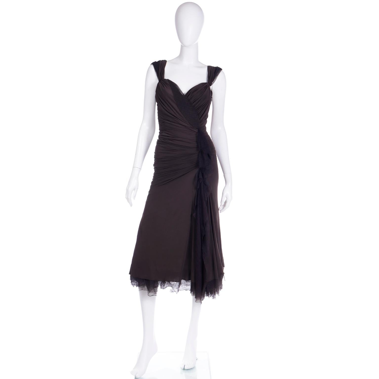 Donna Karan dresses are always so incredibly versatile and easy to wear! This F/W 2004 vintage Donna Karan evening dress is in a very fine lovely brown Viscose blend fabric with fine mesh details. The dress shows so much movement when worn and we