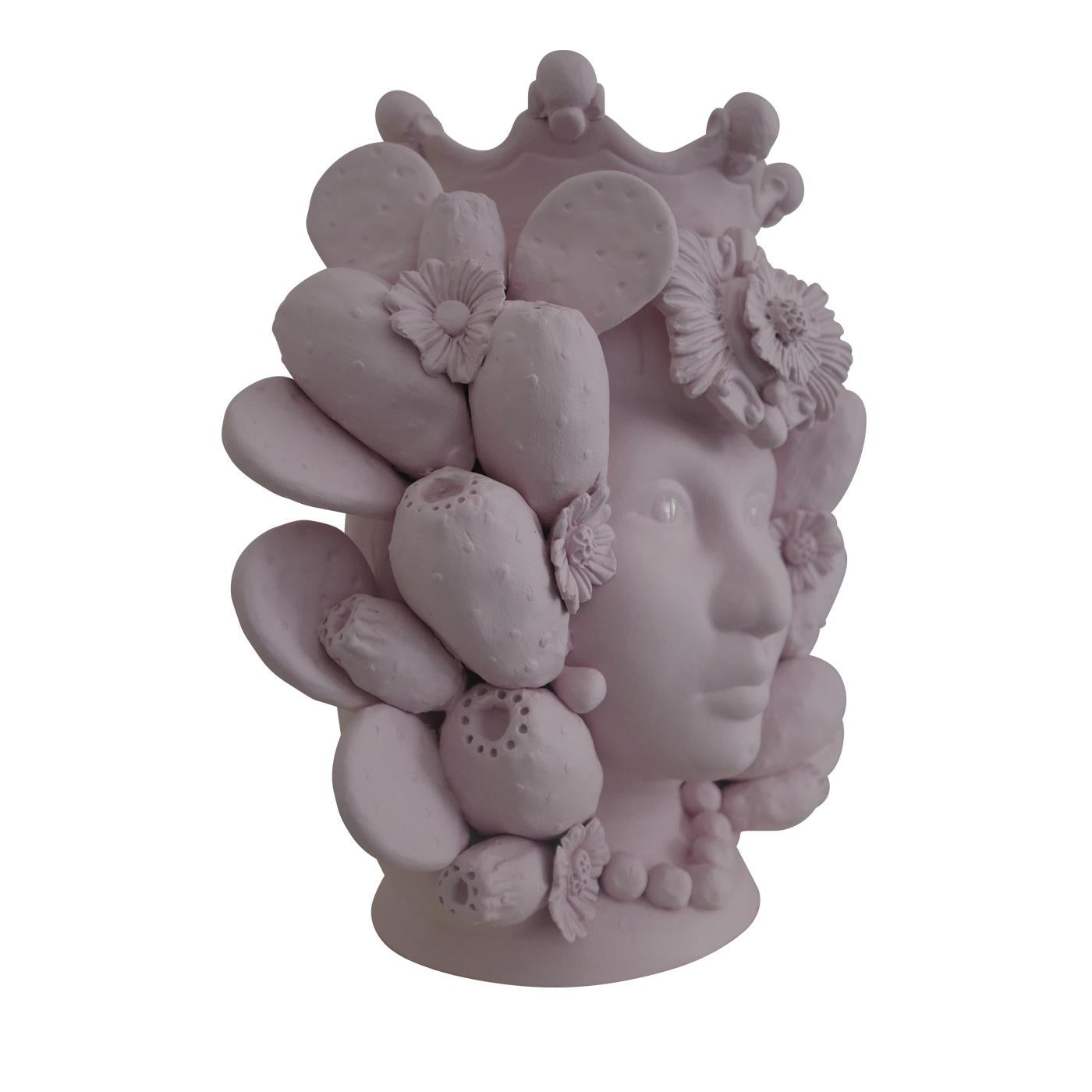 This anthropomorphic vase is made entirely by hand and painted in a light pink matte monochrome tint, rich in natural pigments and resin binders that provide intense color depth. Only the eyes are glazed so they stand out, emphasizing the beauty of