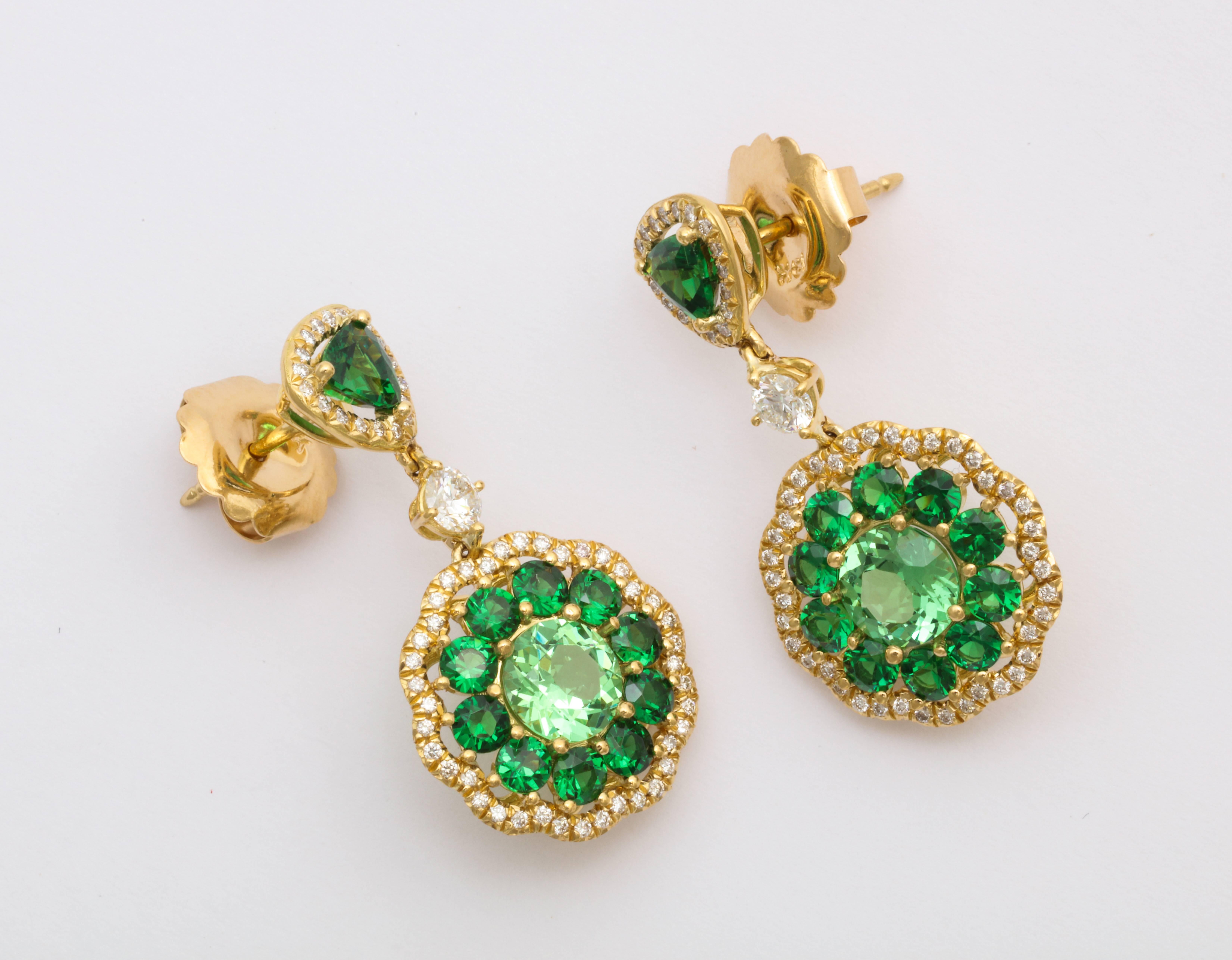 One of a kind. These 18KYG earrings are composed of the finest quality tsavorite garnet in a three shades of green, and accented with round brilliant diamonds. Easily modified for clip-on instead of post. Tsavorite = 5.39cts tw  Diamonds = 0.77cts tw